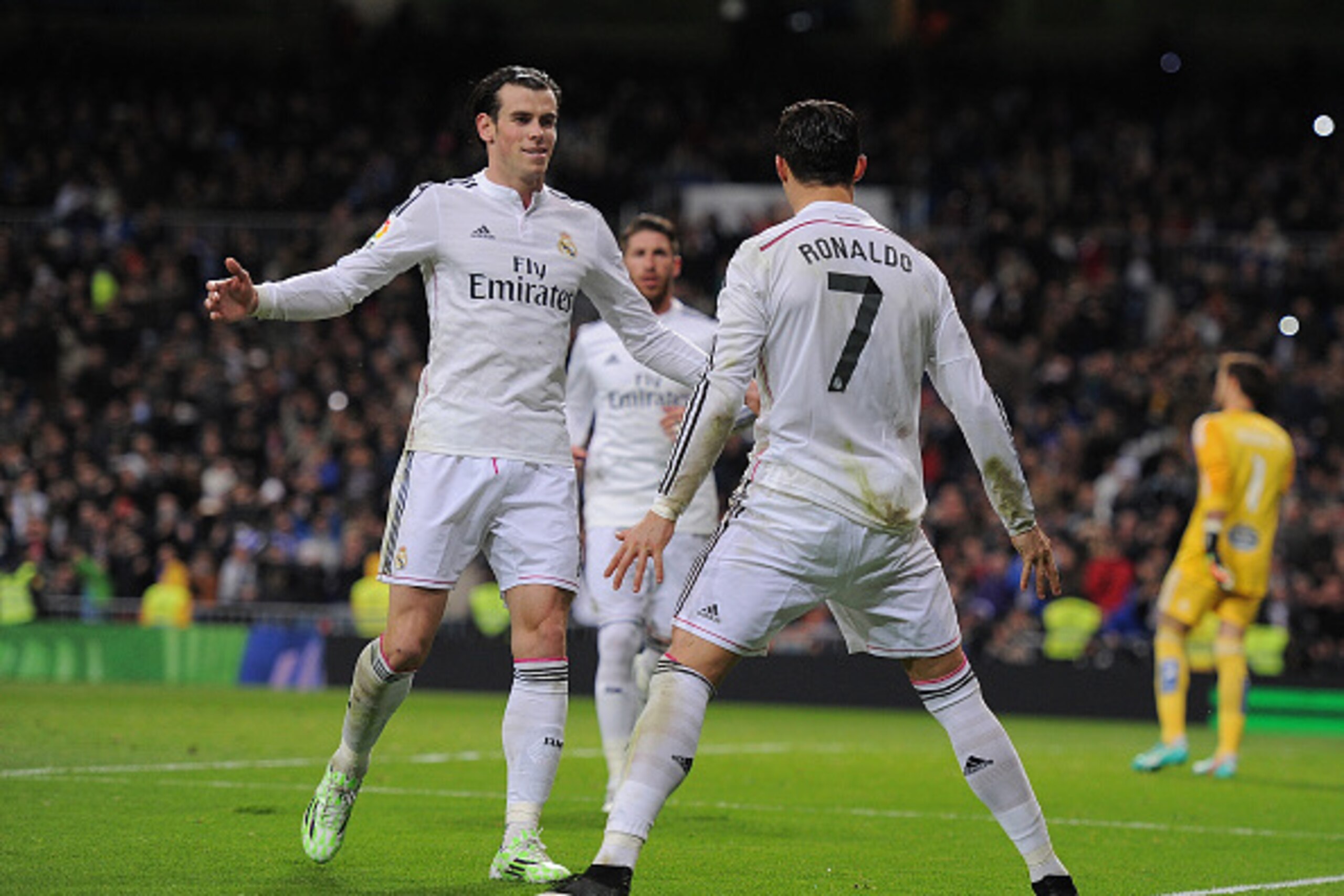 MADRID, SPAIN - DECEMBER 06:  Cristiano Ronaldo of Real Madrid celebrates with Gareth Bale after scoring Real's opening goal during the La Liga match between Real Madrid CF and Celta Vigo at Estadio Santiago Bernabeu on December 6, 2014 in Madrid, Spain. 