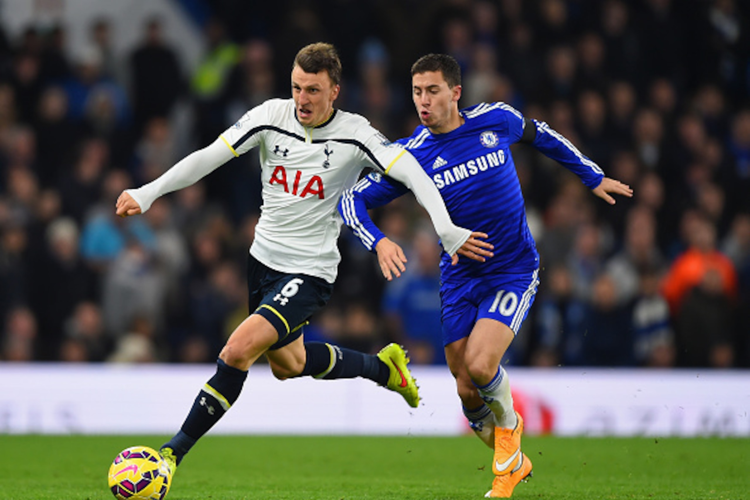 LONDON, ENGLAND - DECEMBER 03:  Eden Hazard of Chelsea and Vlad Chiriches of Spurs battle for the ball during the Barclays Premier League match between Chelsea and Tottenham Hotspur at Stamford Bridge on December 3, 2014 in London, England.  (Photo by Sha