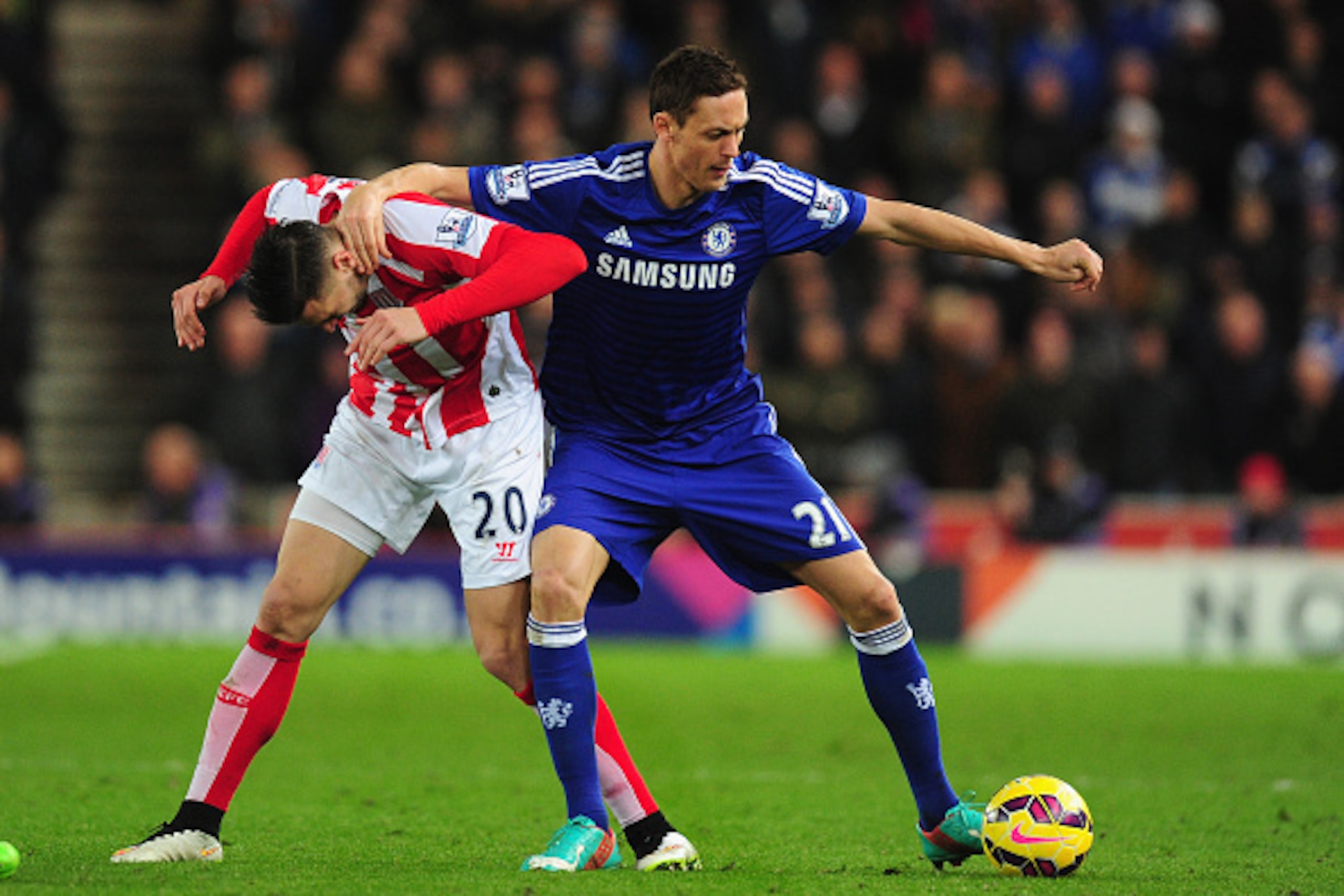 STOKE ON TRENT, ENGLAND - DECEMBER 22: Chelsea player Nemanja Matic (r) is challenged by Geoff Cameron of Stoke during the Barclays Premier League match between Stoke City and Chelsea at Britannia Stadium on December 22, 2014 in Stoke on Trent, England. STOKE ON TRENT, ENGLAND - DECEMBER 22: Chelsea player Nemanja Matic (r) is challenged by Geoff Cameron of Stoke during the Barclays Premier League match between Stoke City and Chelsea at Britannia Stadium on December 22, 2014 in Stoke on Trent, England.