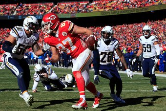 KANSAS CITY, MO - DECEMBER 28:  Tight end Travis Kelce #87 of the Kansas City Chiefs recovers a ball fumbled by wide receiver Dwayne Bowe #82 in the end zone for a touchdown during the game against the San Diego Chargers at Arrowhead Stadium on December 2