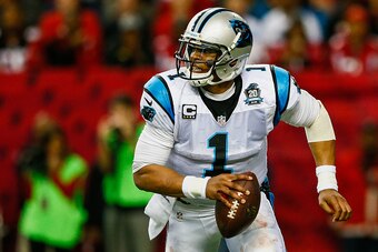 ATLANTA, GA - DECEMBER 28: Cam Newton #1 of the Carolina Panthers rolls out on a pass play in the first half against the Carolina Panthers at the Georgia Dome on December 28, 2014 in Atlanta, Georgia.  (Photo by Kevin C. Cox/Getty Images)
