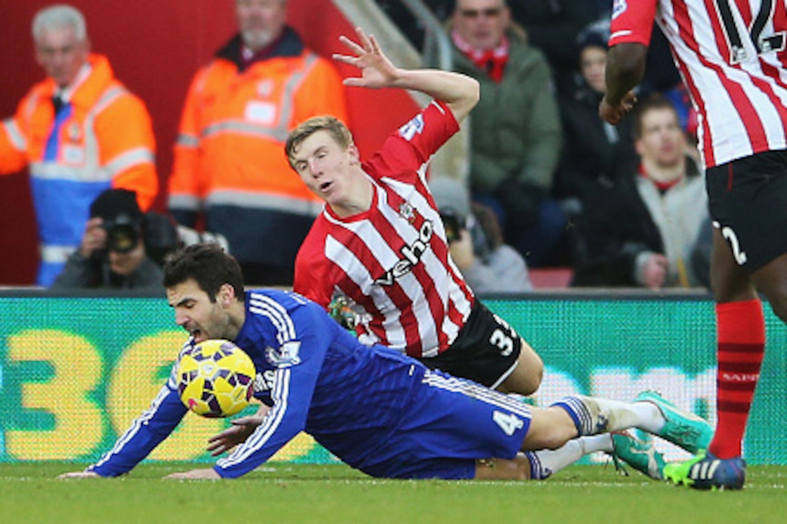 SOUTHAMPTON, ENGLAND - DECEMBER 28: Cesc Fabregas of Chelsea goes down in the penalty area after a challenge by Matt Targett of Southampton and is booked for diving during the Barclays Premier League match between Southampton and Chelsea at St Mary's Stad
