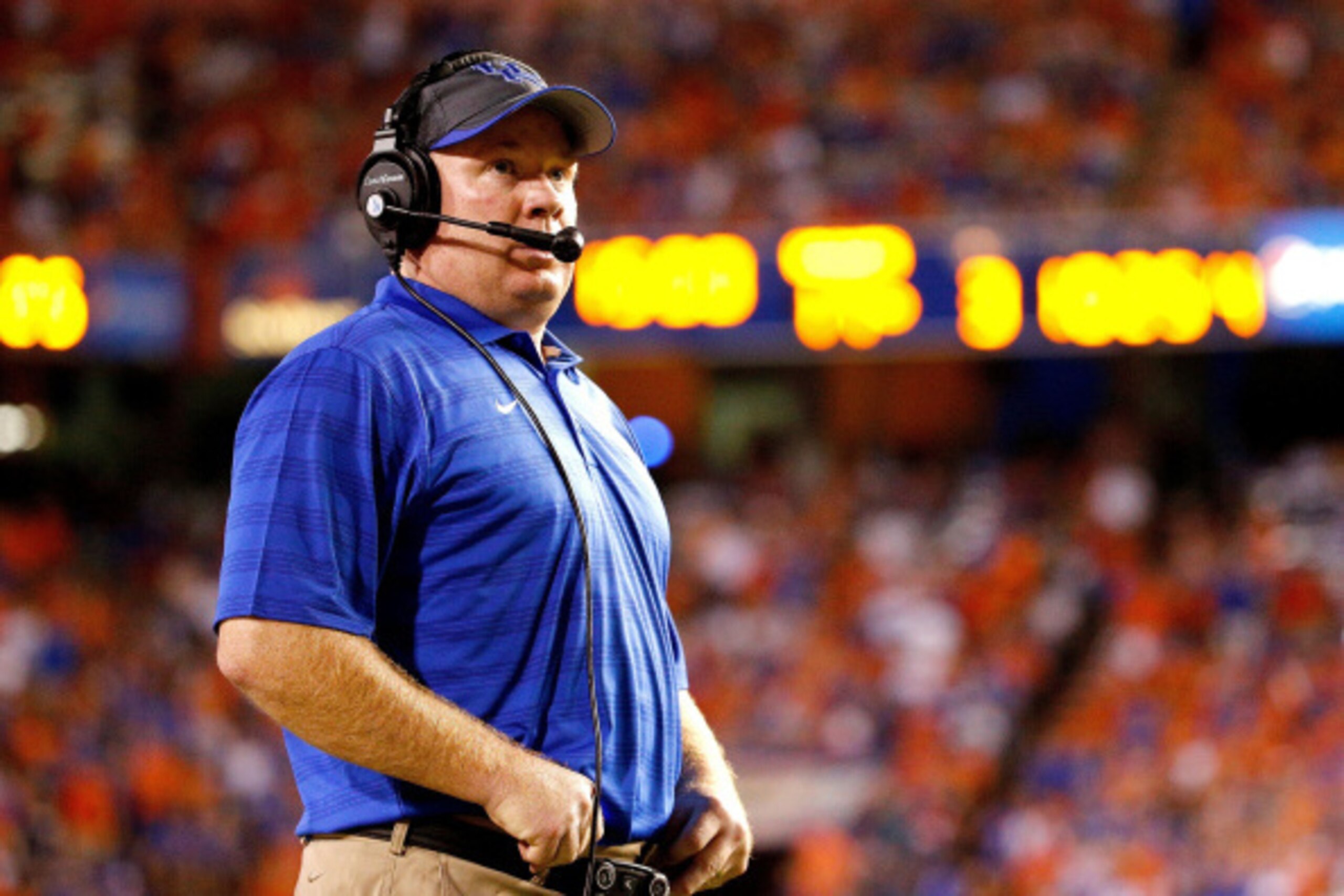 GAINESVILLE, FL - SEPTEMBER 13:  Head coach Mark Stoops of the Kentucky Wildcats looks on during the second half of the game against the Florida Gators at Ben Hill Griffin Stadium on September 13, 2014 in Gainesville, Florida.  (Photo by Rob Foldy/Getty I