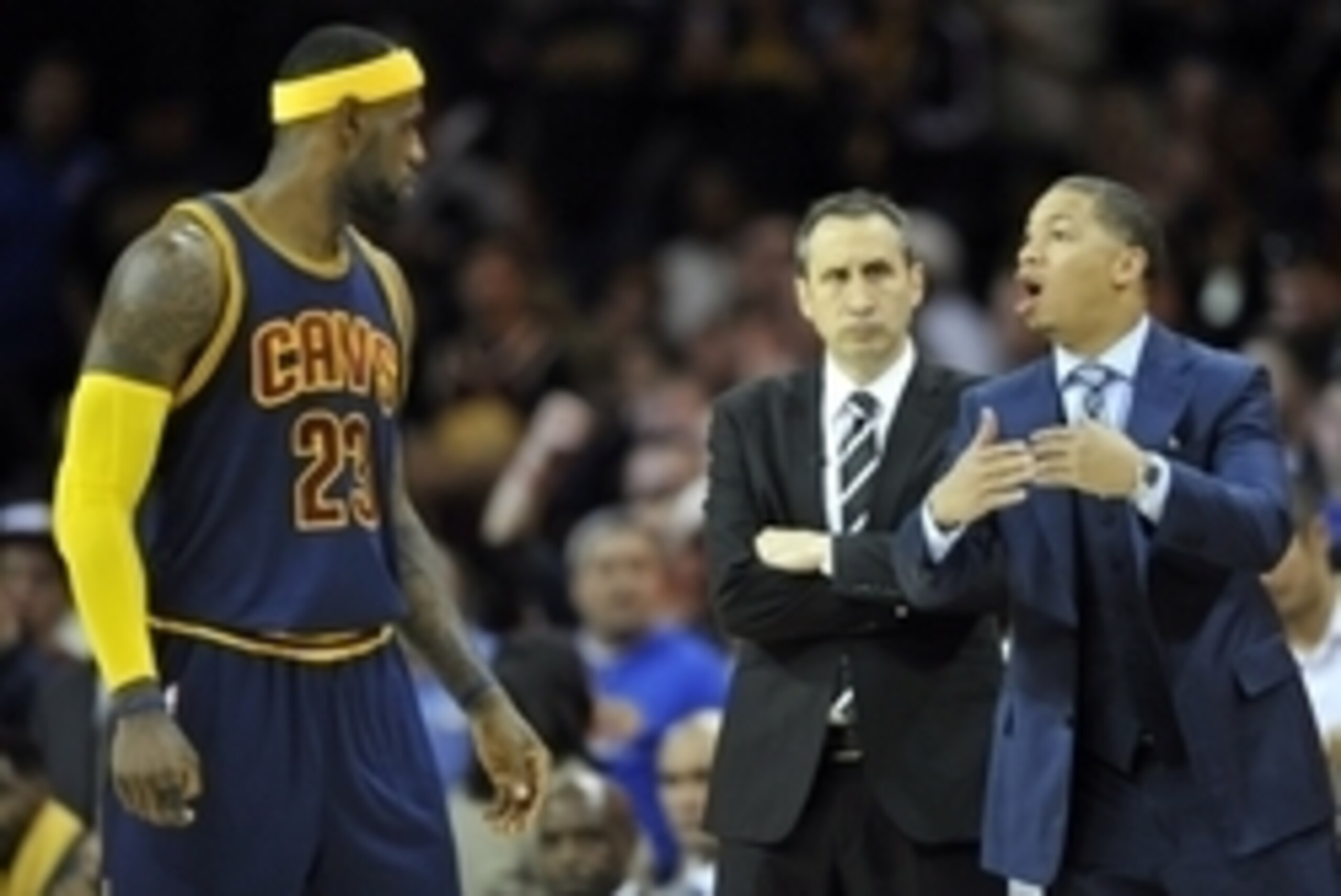 Oct 30, 2014; Cleveland, OH, USA; Cleveland Cavaliers head coach David Blatt (center) and assistant coach Tyronn Lue (right) stand near forward LeBron James (23) against the New York Knicks at Quicken Loans Arena. New York won 95-90. Mandatory Credit: Dav