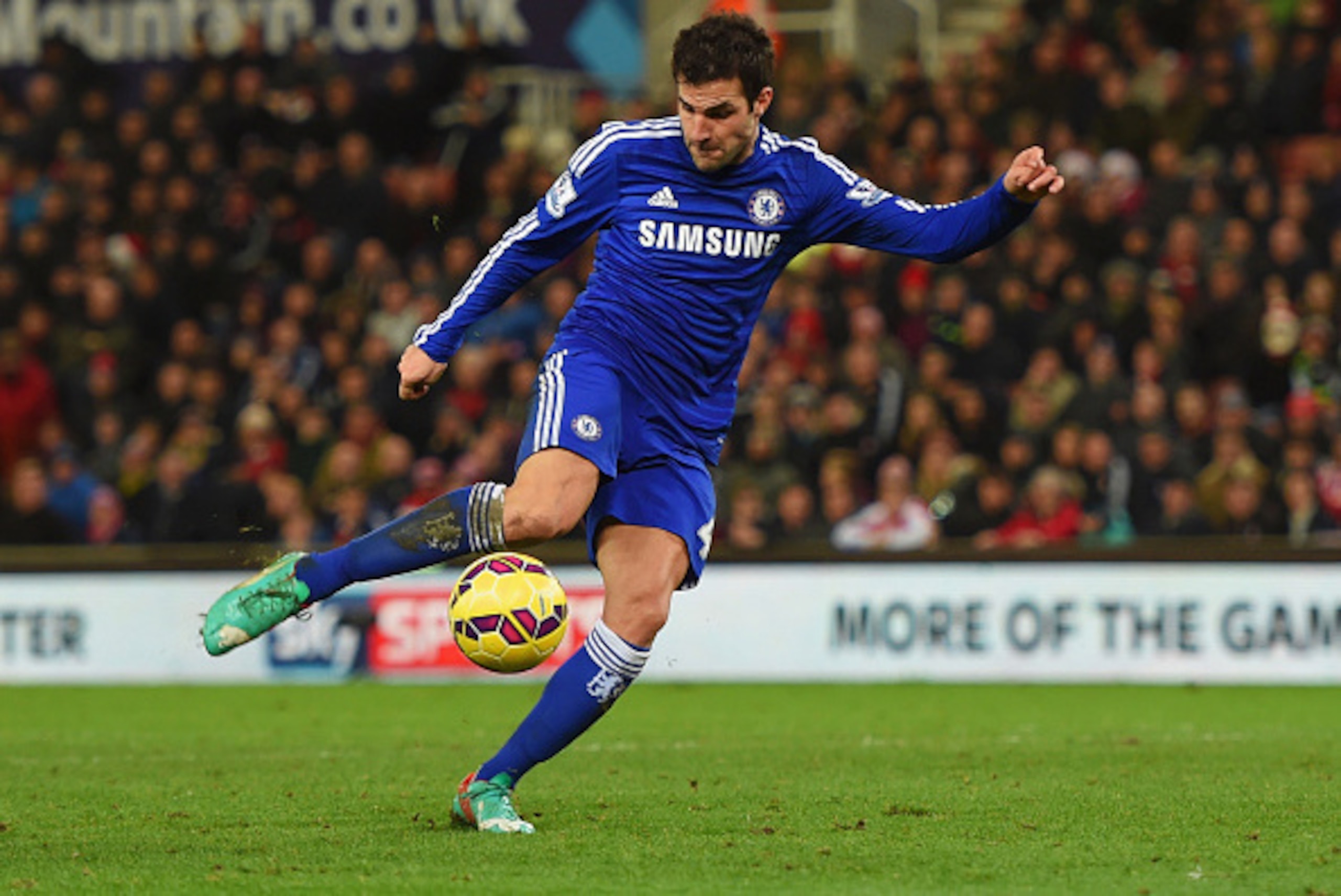 STOKE ON TRENT, ENGLAND - DECEMBER 22:  Cesc Fabregas of Chelsea scores their second goal during the Barclays Premier League match between Stoke City and Chelsea at Britannia Stadium on December 22, 2014 in Stoke on Trent, England.  (Photo by Michael Rega