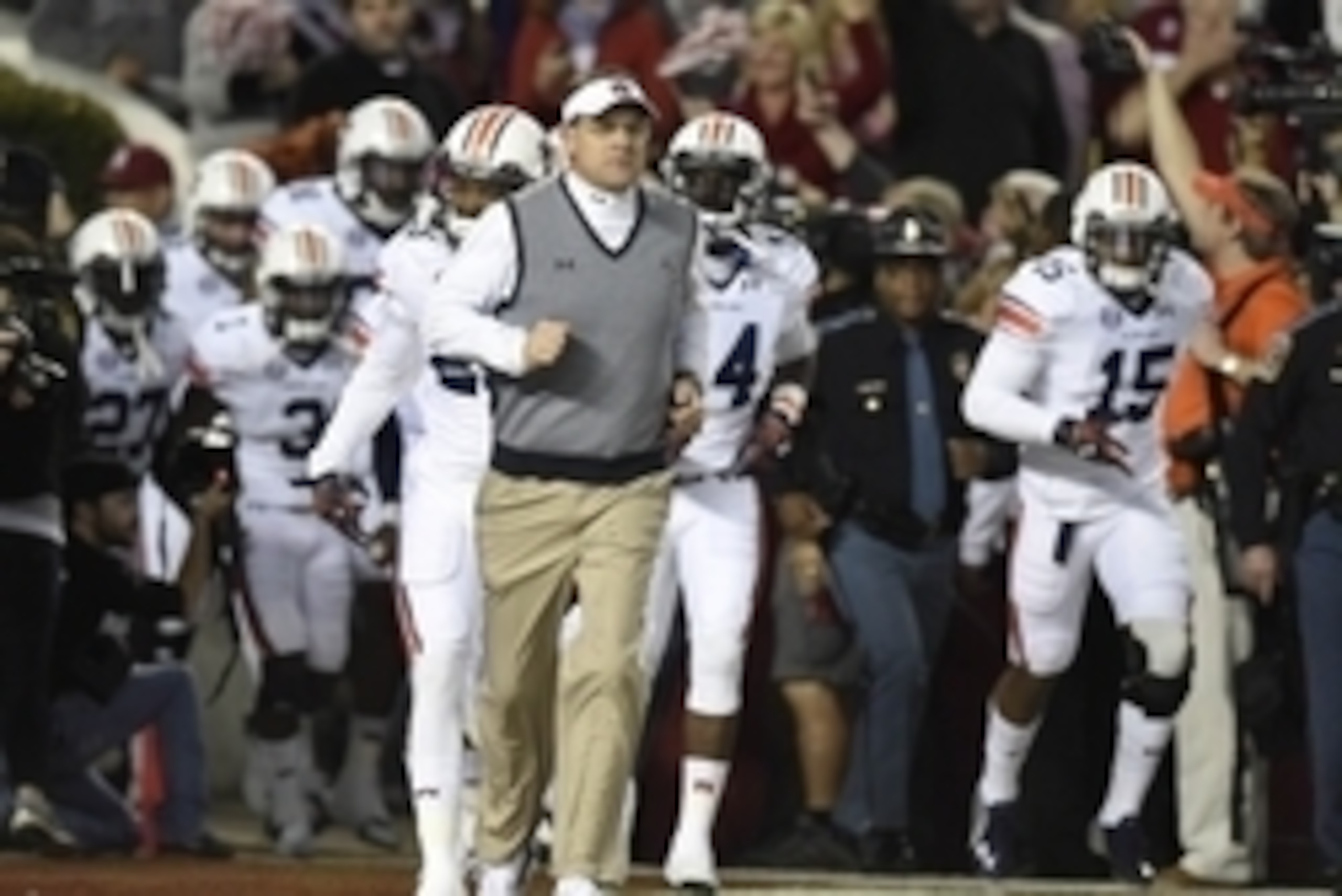 Nov 29, 2014; Tuscaloosa, AL, USA; Auburn Tigers head coach Gus Malzahn runs onto the field prior to facing the Alabama Crimson Tide at Bryant-Denny Stadium. Mandatory Credit: John David Mercer-USA TODAY Sports