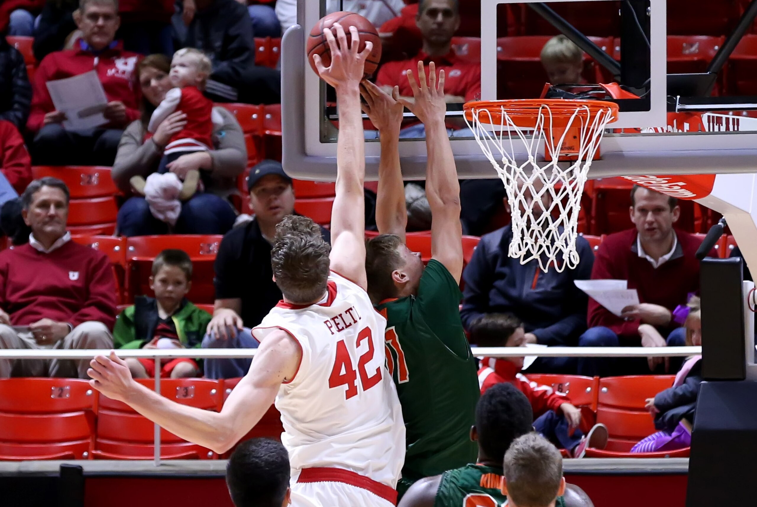 Nov 26, 2014; Salt Lake City, UT, USA; Utah Utes forward Jakob Poeltl (42) blocks a shot by Texas-Pan American Broncs forward Andreas Bigum (11) during the first half at Jon M. Huntsman Center. Mandatory Credit: Chris Nicoll-USA TODAY Sports