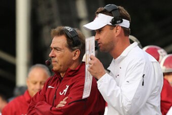 OXFORD, MS - OCTOBER 4: Nick Saban, Head coach of the Alabama Crimson Tide and Offensive Coordinator Lane Kiffin of the Alabama Crimson Tide talk on the sideline against the Ole Miss Rebels  on OCTOBER 4, 2014 at Vaught-Hemingway Stadium in Oxford, Missis