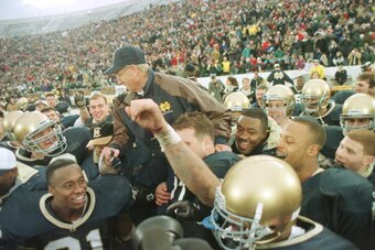 23 Nov1996:  Head coach Lou Holtz of the Notre Dame Fighting Irish is carried off the field by his team after defeating the Rutgers Scarlet Knights 62-0 at Notre Dame Stadium in South Bend, Indiana.  Mandatory Credit: Jonathan Daniel/Allsport