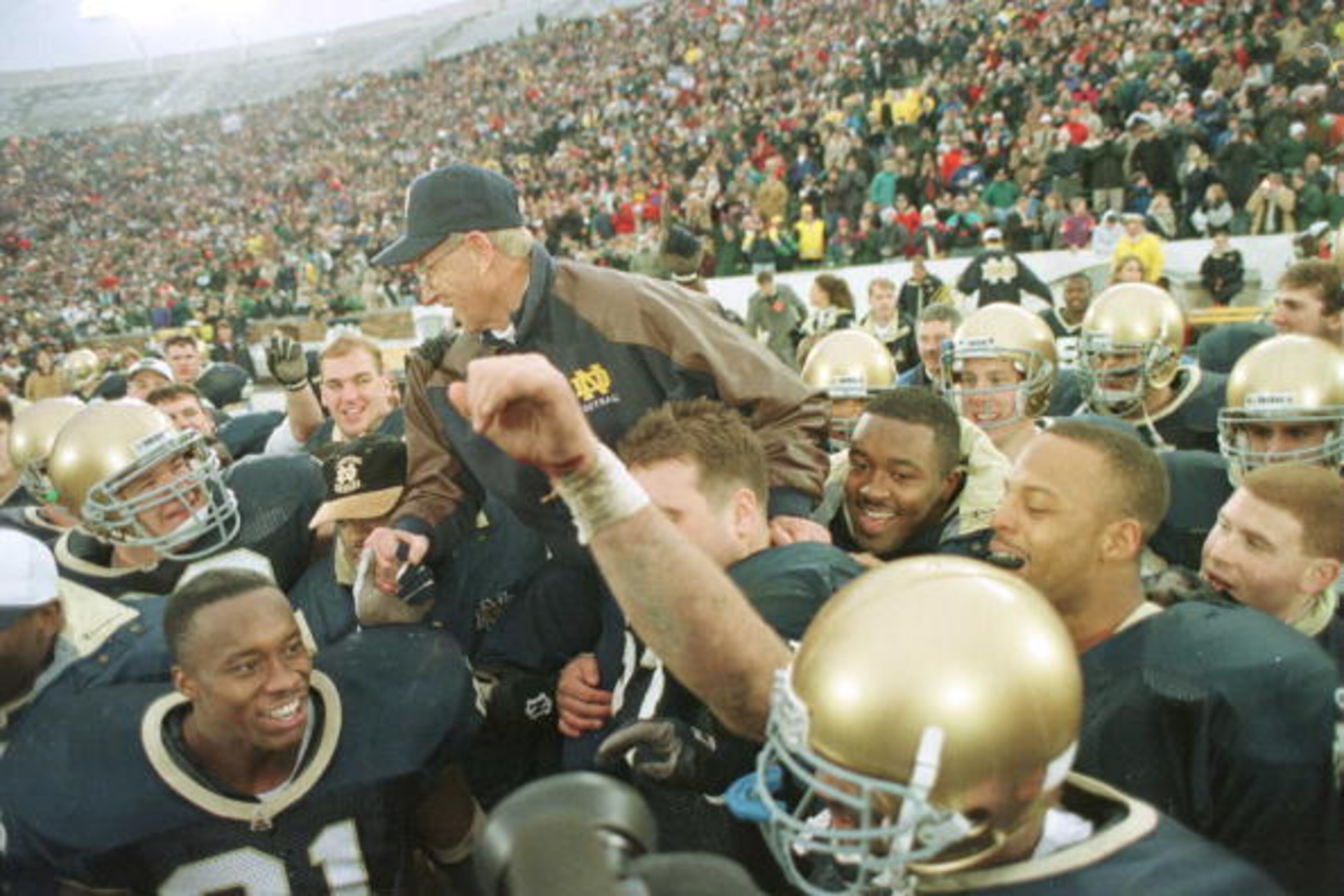 23 Nov1996: Head coach Lou Holtz of the Notre Dame Fighting Irish is carried off the field by his team after defeating the Rutgers Scarlet Knights 62-0 at Notre Dame Stadium in South Bend, Indiana. Mandatory Credit: Jonathan Daniel/Allsport 23 Nov1996: Head coach Lou Holtz of the Notre Dame Fighting Irish is carried off the field by his team after defeating the Rutgers Scarlet Knights 62-0 at Notre Dame Stadium in South Bend, Indiana. Mandatory Credit: Jonathan Daniel/Allsport