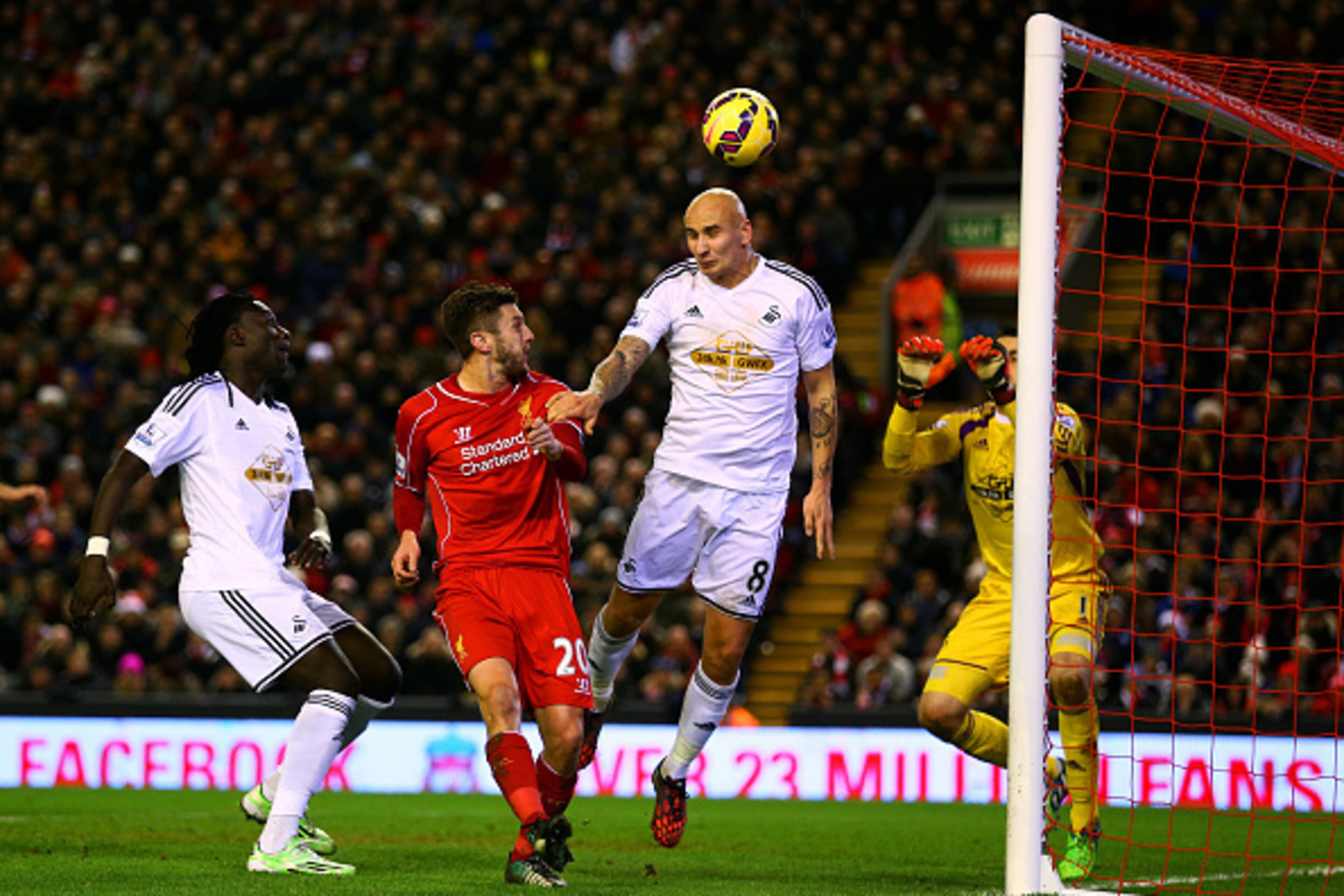 LIVERPOOL, ENGLAND - DECEMBER 29:  Jonjo Shelvey of Swansea City scores an own goal during the Barclays Premier League match between Liverpool and Swansea City at Anfield on December 29, 2014 in Liverpool, England.  (Photo by Clive Brunskill/Getty Images)