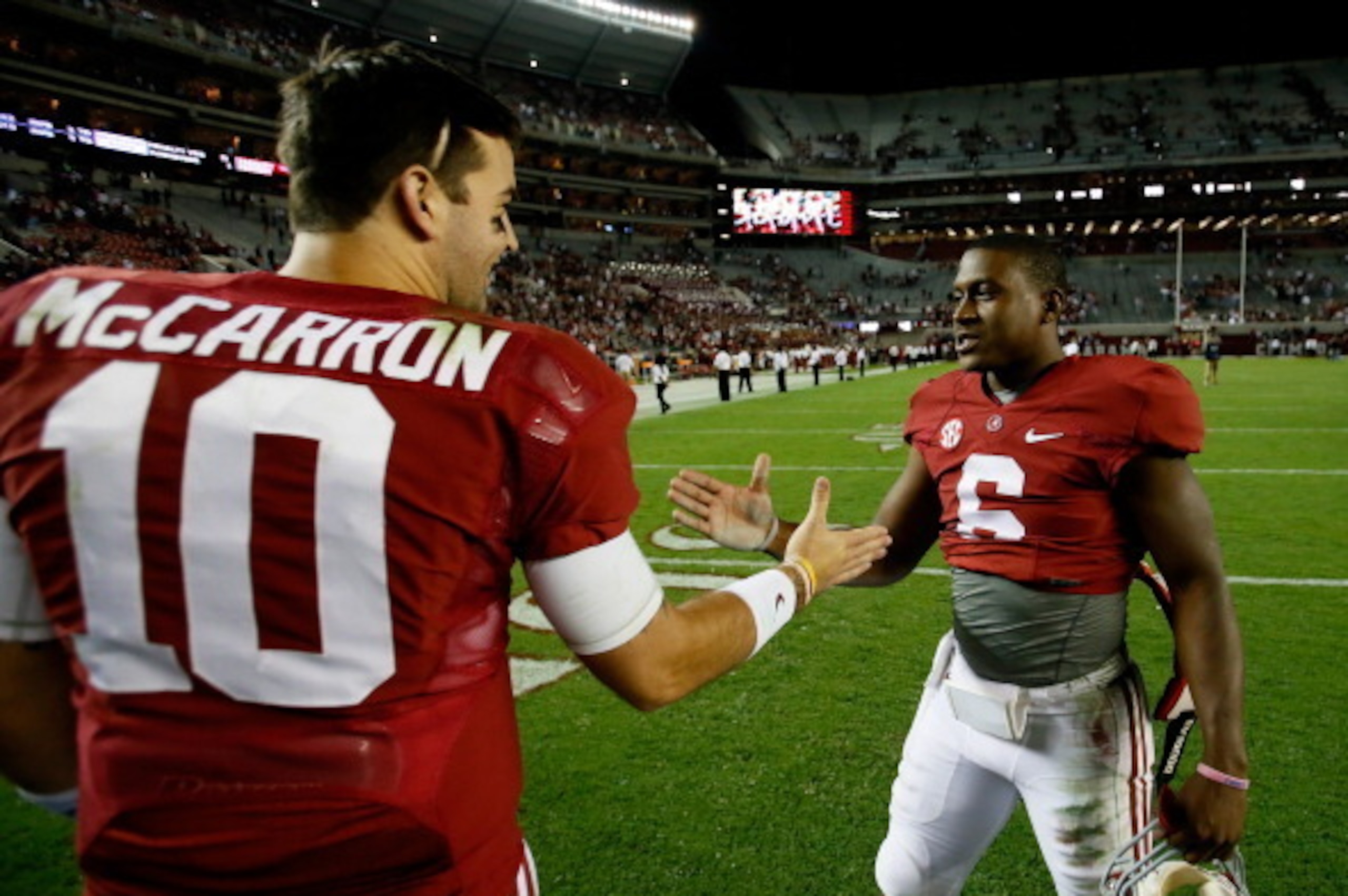 TUSCALOOSA, AL - OCTOBER 19:  Blake Sims #6 of the Alabama Crimson Tide celebrates their 52-0 win over the Arkansas Razorbacks with AJ McCarron #10 at Bryant-Denny Stadium on October 19, 2013 in Tuscaloosa, Alabama.  (Photo by Kevin C. Cox/Getty Images)