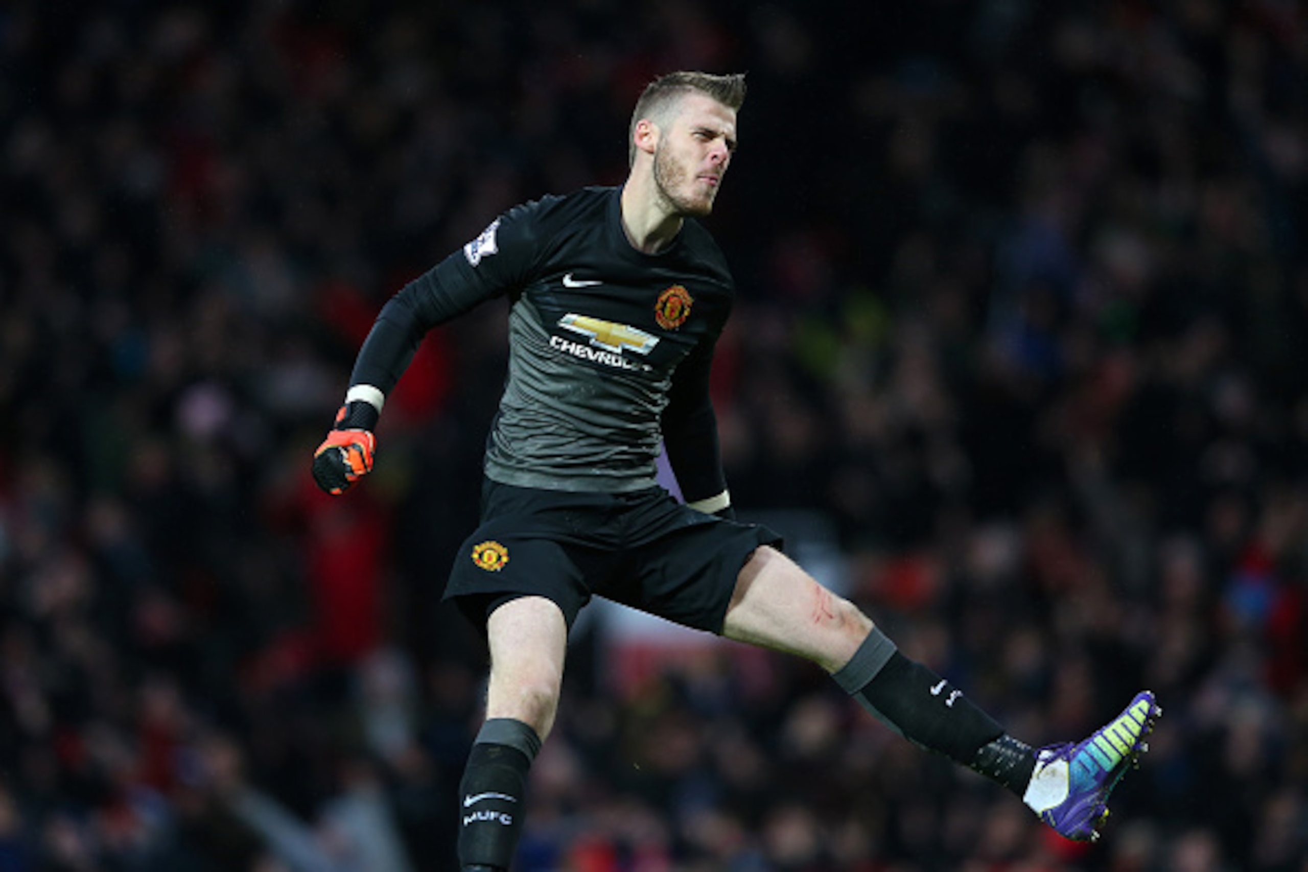 MANCHESTER, ENGLAND - DECEMBER 14:  David De Gea of Manchester United celebrates the third goal during the Barclays Premier League match between Manchester United and Liverpool at Old Trafford on December 14, 2014 in Manchester, England.  (Photo by Alex L
