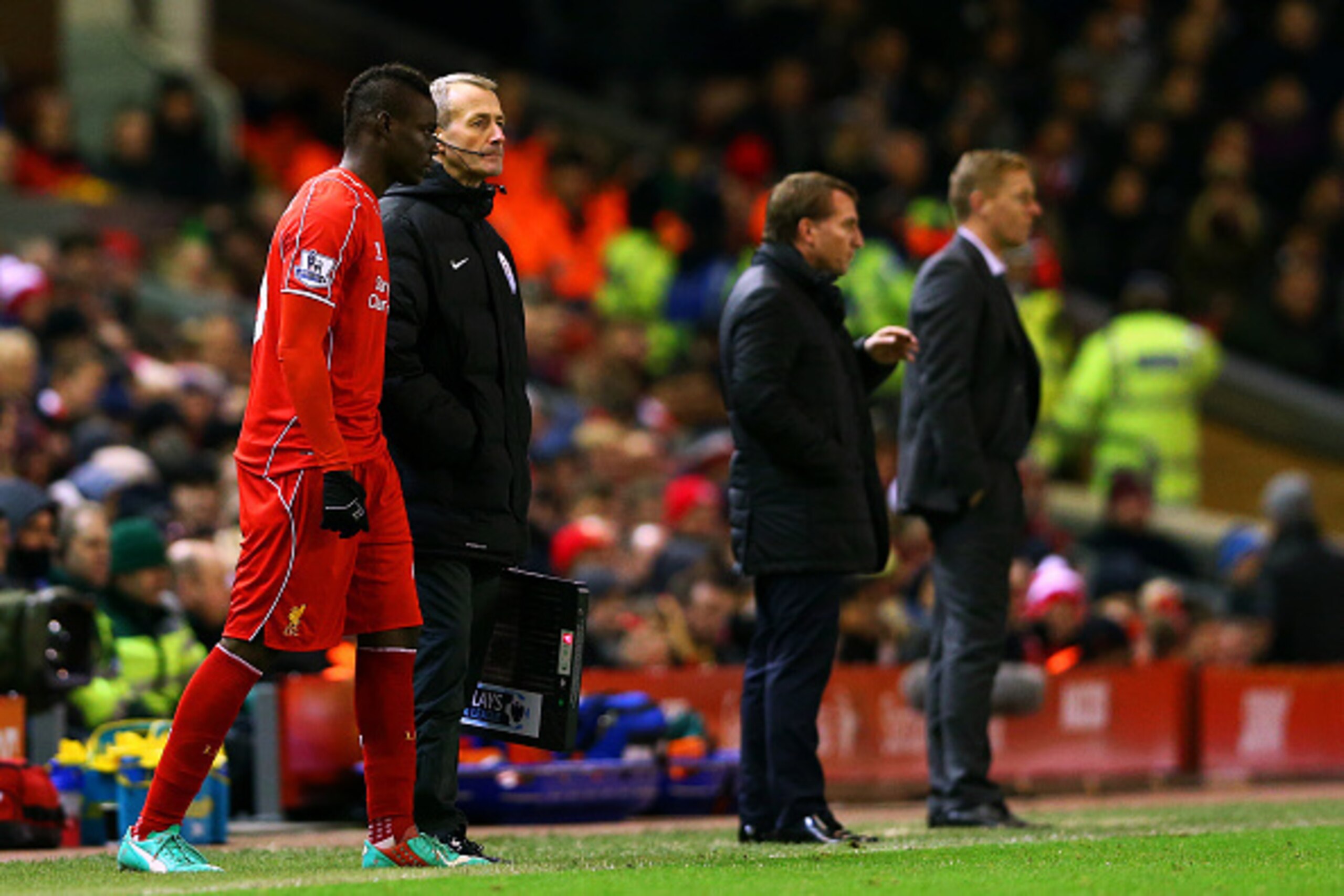 LIVERPOOL, ENGLAND - DECEMBER 29:  Mario Balotelli of Liverpool prepares to come on during the Barclays Premier League match between Liverpool and Swansea City at Anfield on December 29, 2014 in Liverpool, England.  (Photo by Clive Brunskill/Getty Images)