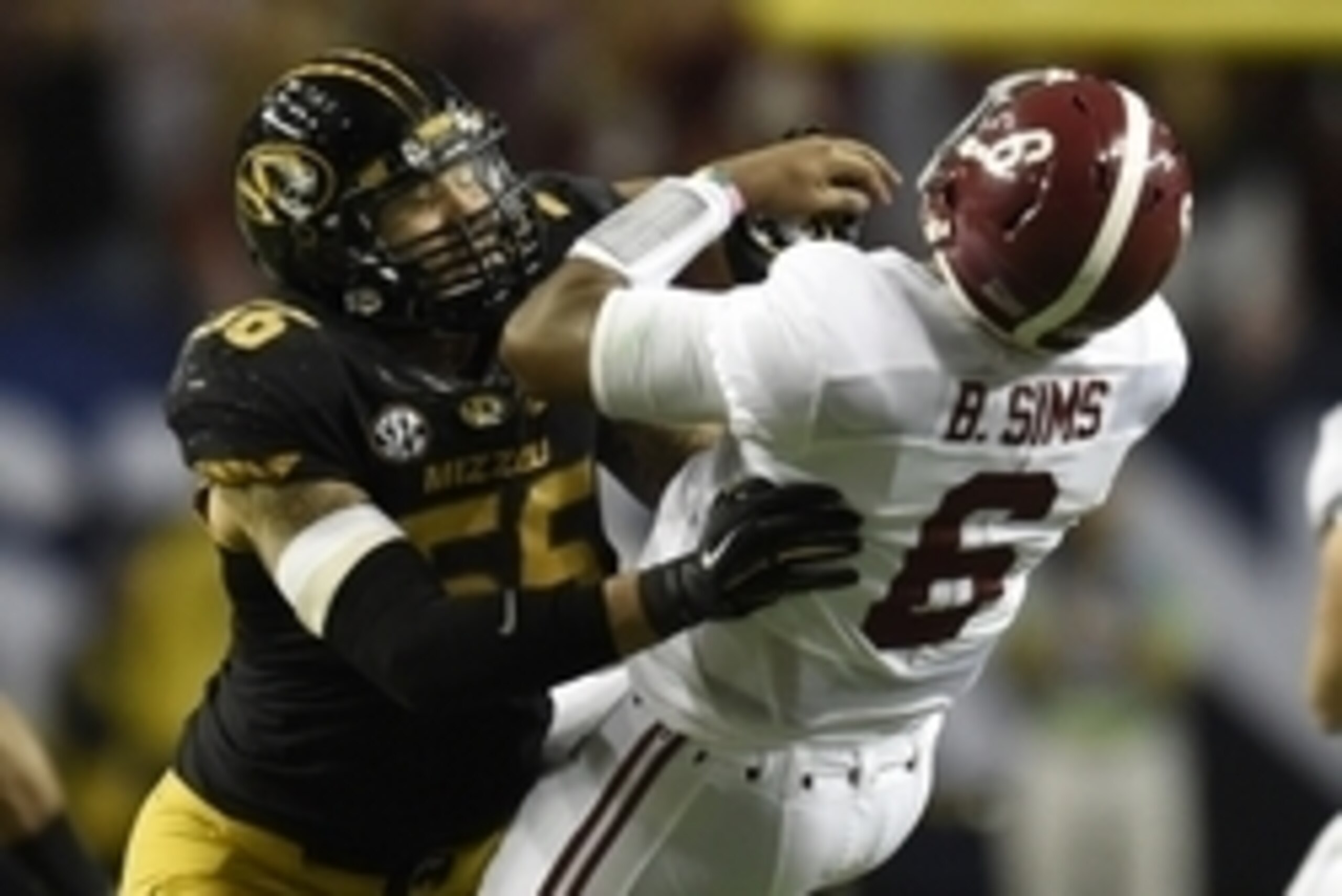 Dec 6, 2014; Atlanta, GA, USA; Missouri Tigers defensive lineman Shane Ray (56) tackles Alabama Crimson Tide quarterback Blake Sims (6) during the second quarter of the 2014 SEC Championship Game at the Georgia Dome. The play caused Ray to be ejected from