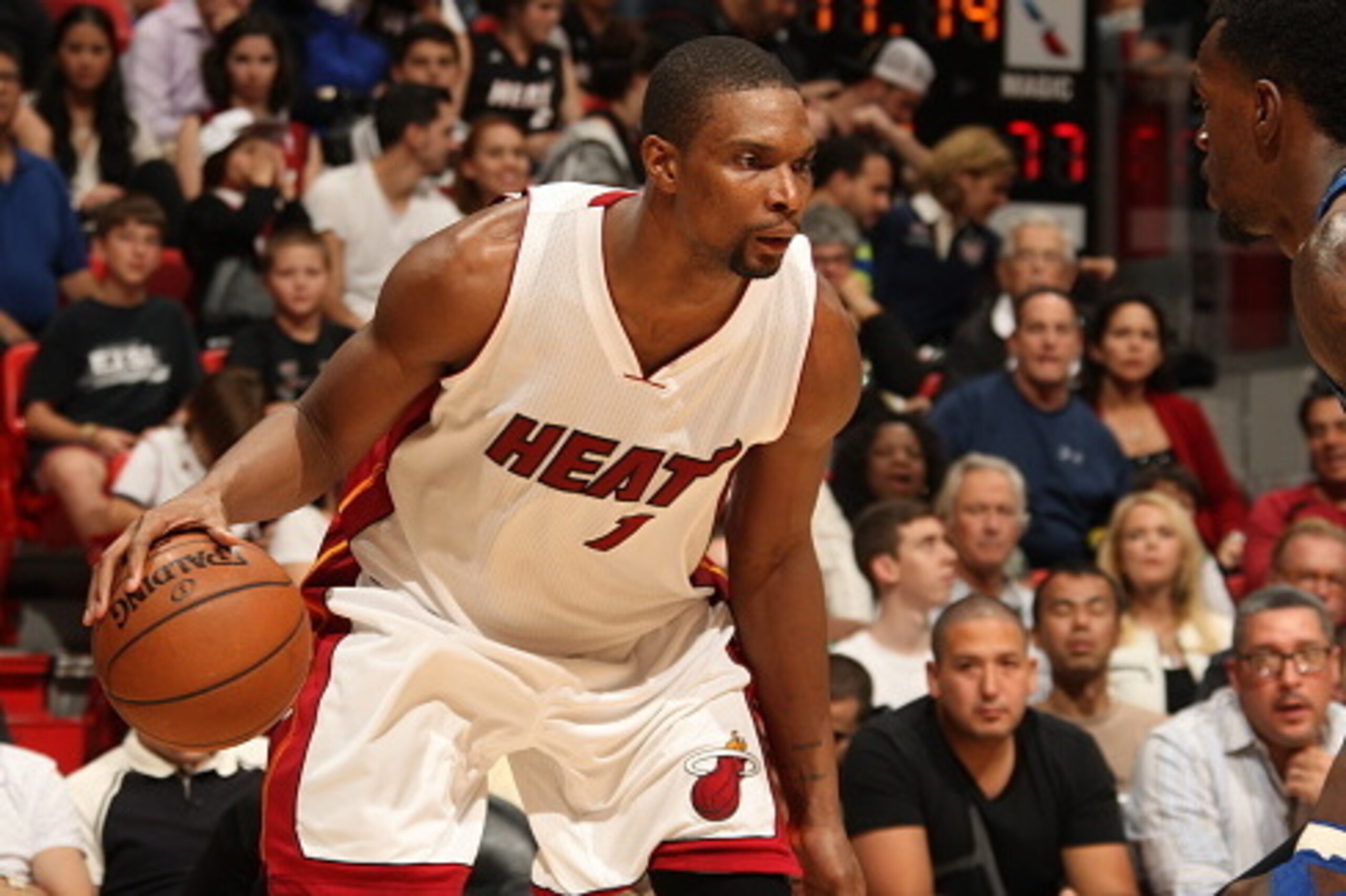 MIAMI, FL - DECEMBER 29:  Chris Bosh #1 of the Miami Heat handles the ball against the Orlando Magic on December 29, 2014 at American Airlines Arena in Miami, Florida.  NOTE TO USER: User expressly acknowledges and agrees that, by downloading and or using