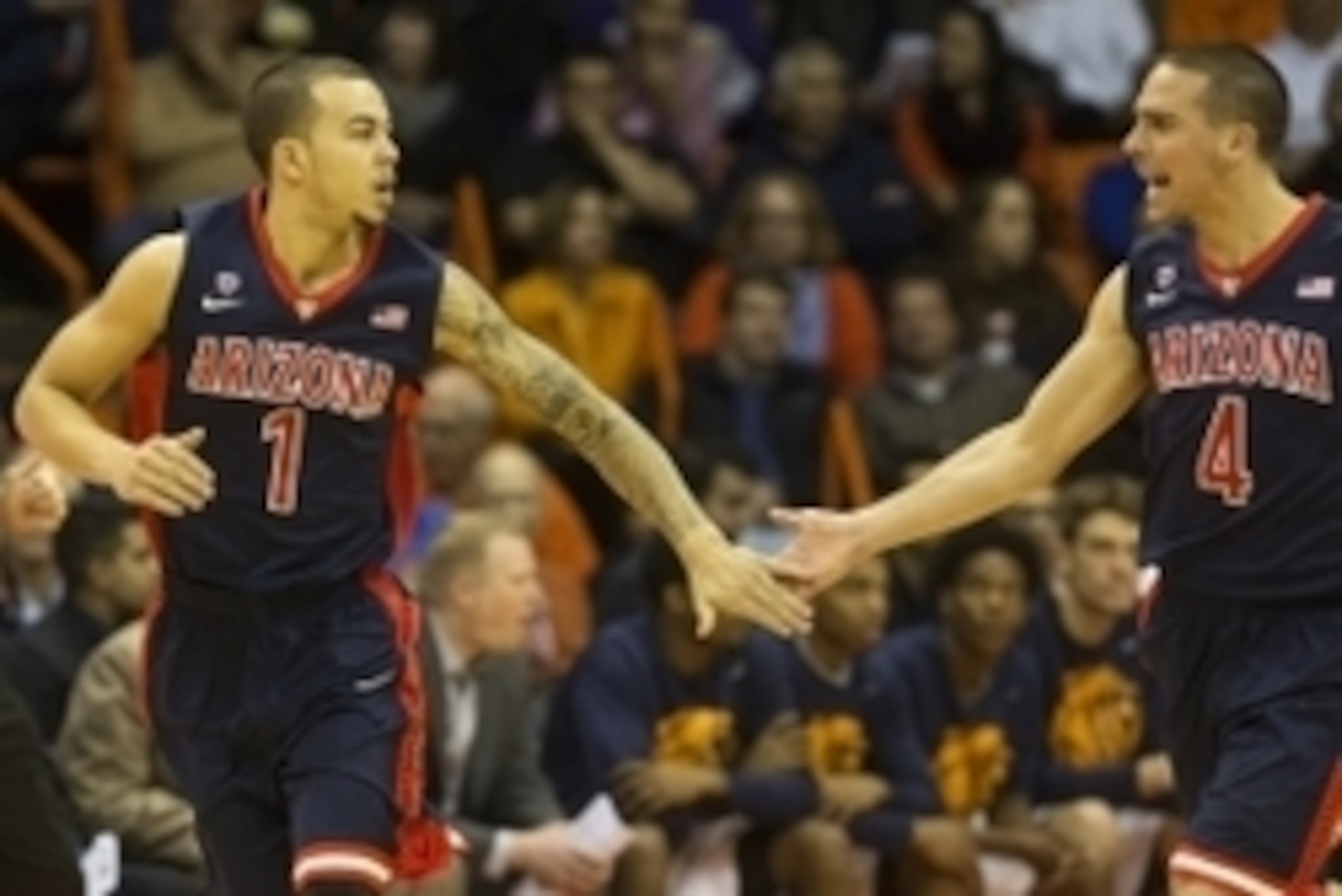 Dec 19, 2014; El Paso, TX, USA; Arizona Wildcats Gabe York (1) celebrates with guard T.J. McConnell (4) after scoring against the UTEP Miners defense at Don Haskins Center. Mandatory Credit: Ivan Pierre Aguirre-USA TODAY Sports