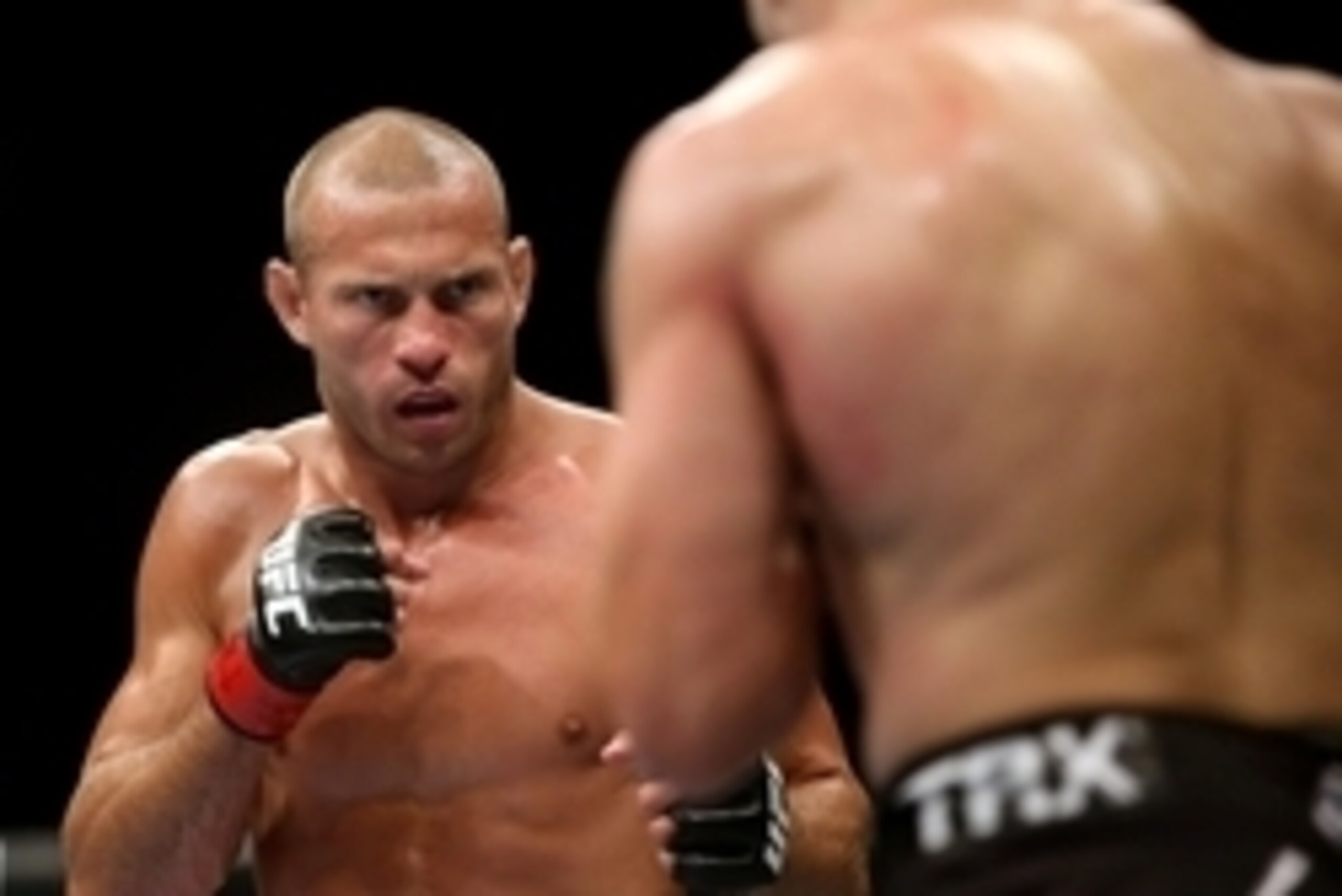 Jul 16, 2014; Atlantic City, NJ, USA; Donald Cerrone (red gloves) stares down Jim Miller (blue gloves) during a 5-round lightweight bout at Revel Casino. Mandatory Credit: Bill Streicher-USA TODAY Sports