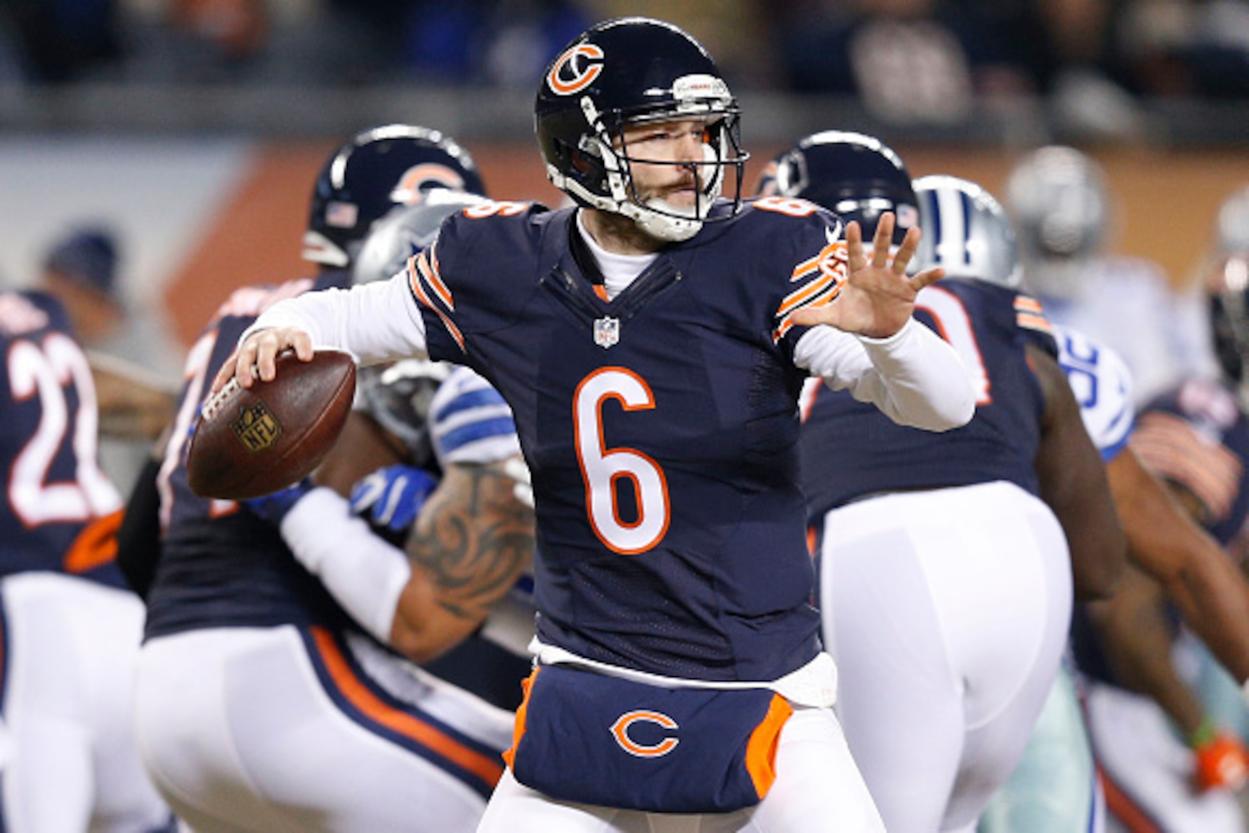 CHICAGO, IL - DECEMBER 4: Jay Cutler #6 of the Chicago Bears passes during the first quarter of a game against the Dallas Cowboys at Soldier Field on December 4, 2014 in Chicago, Illinois. (Photo by Joe Robbins/Getty Images)