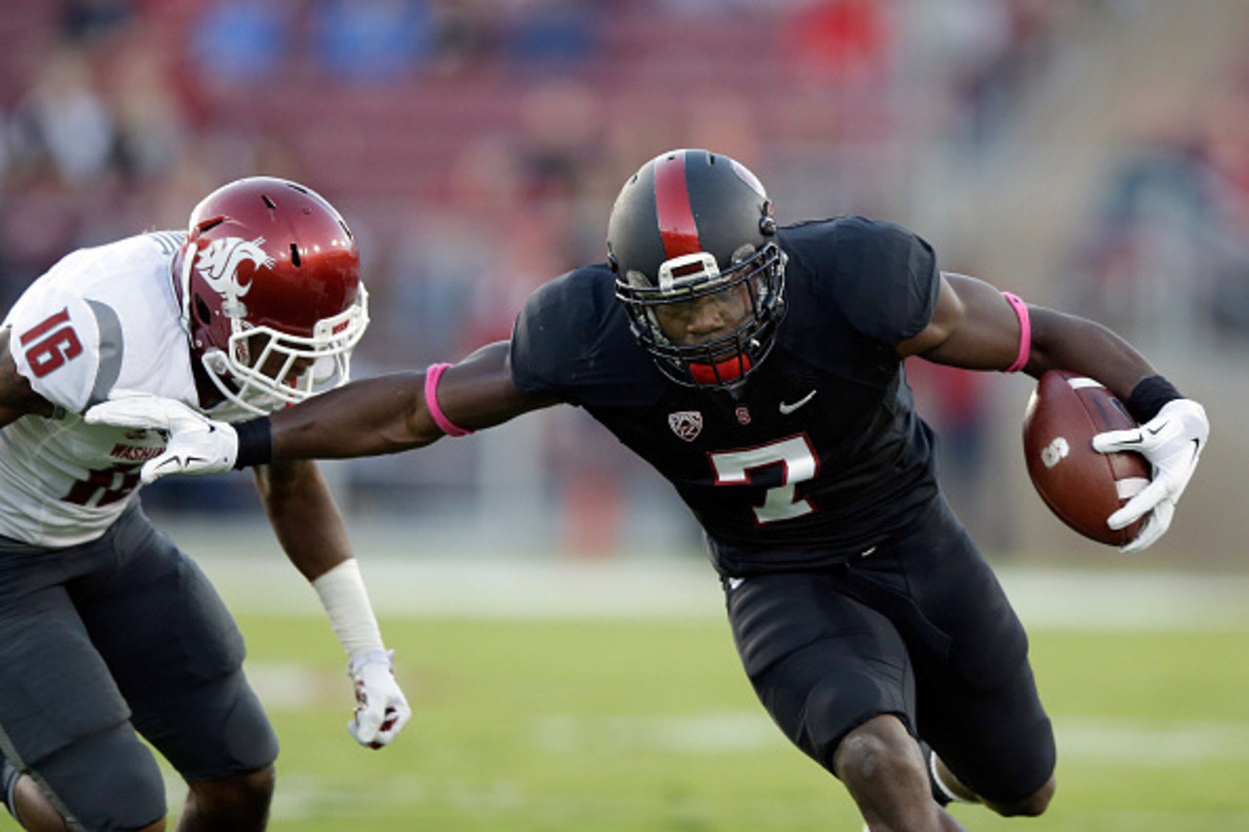 PALO ALTO, CA - OCTOBER 10:  Ty Montgomery #7 of the Stanford Cardinal tries to run away from Charleston White #16 of the Washington State Cougars at Stanford Stadium on October 10, 2014 in Palo Alto, California.  (Photo by Ezra Shaw/Getty Images)