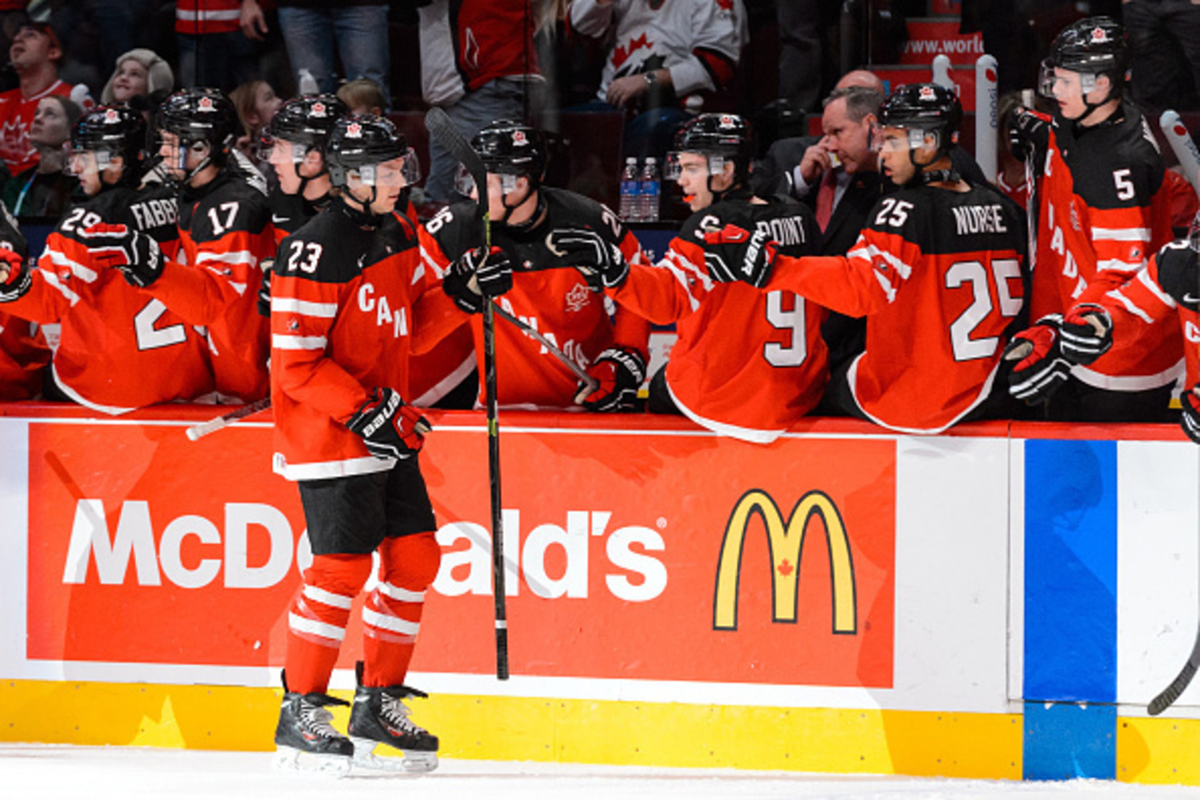 MONTREAL, QC - DECEMBER 29: Sam Reinhart #23 of Team Canada celebrates his goal with teammates on the bench during the 2015 IIHF World Junior Hockey Championship game against Team Finland at the Bell Centre on December 29, 2014 in Montreal, Quebec, Canad MONTREAL, QC - DECEMBER 29: Sam Reinhart #23 of Team Canada celebrates his goal with teammates on the bench during the 2015 IIHF World Junior Hockey Championship game against Team Finland at the Bell Centre on December 29, 2014 in Montreal, Quebec, Canad