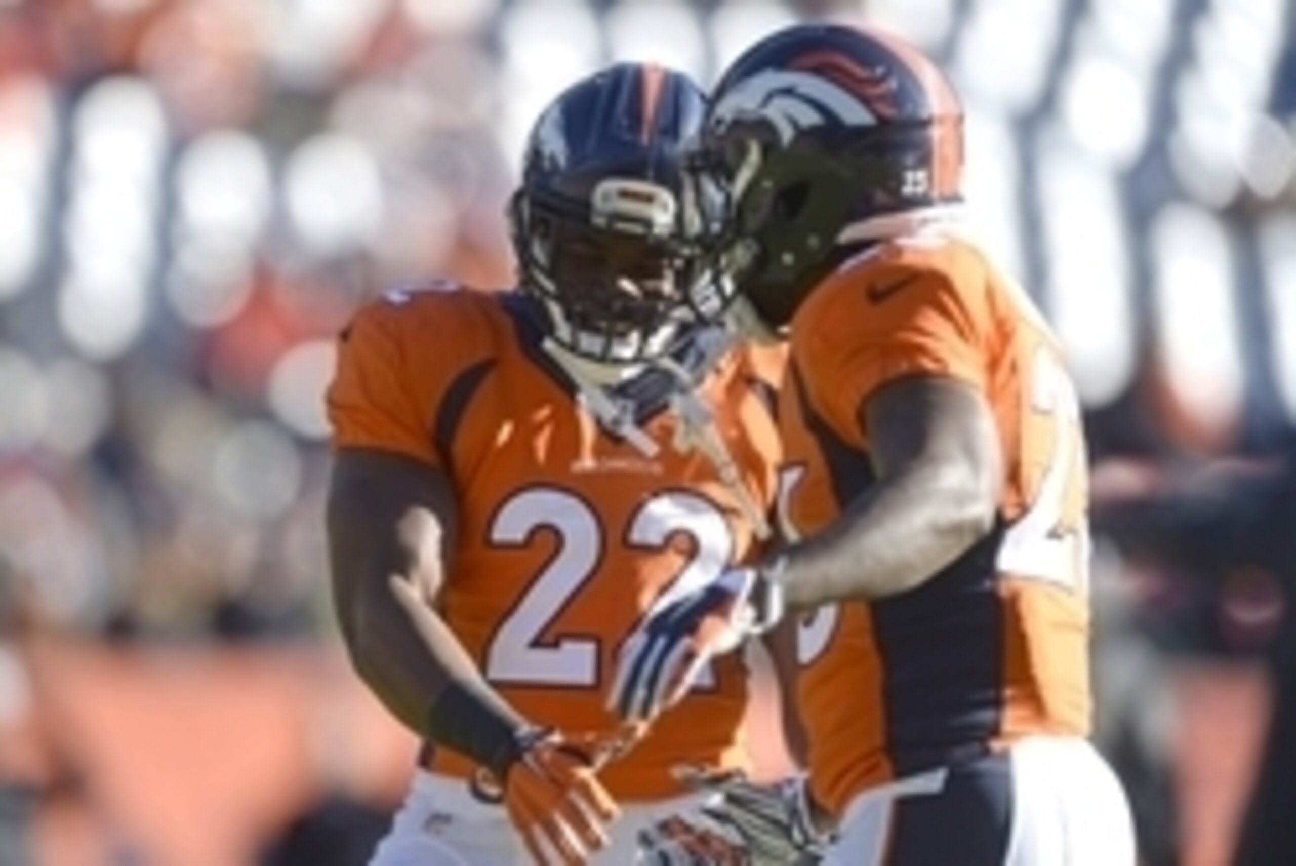 Dec 28, 2014; Denver, CO, USA; Denver Broncos running back C.J. Anderson (22) and running back Ronnie Hillman (23) great each other before the start of the game against the Oakland Raiders at Sports Authority Field at Mile High. Mandatory Credit: Ron Chen Dec 28, 2014; Denver, CO, USA; Denver Broncos running back C.J. Anderson (22) and running back Ronnie Hillman (23) great each other before the start of the game against the Oakland Raiders at Sports Authority Field at Mile High. Mandatory Credit: Ron Chen
