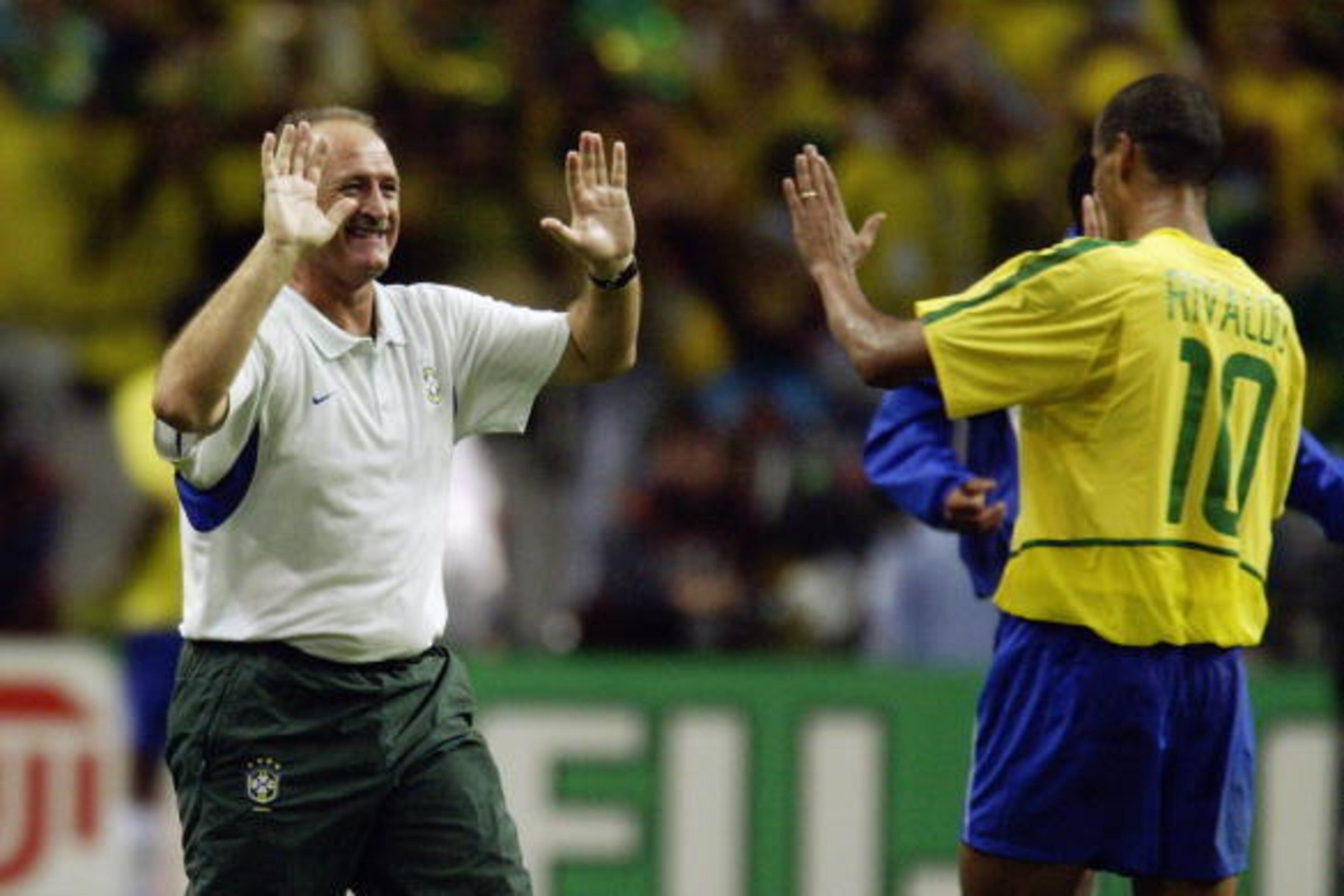 SAITAMA-KEN - JUNE 26: Brazil coach Luiz Felipe Scolari celebrates victory with Rivaldo after the FIFA World Cup Finals 2002 Semi-Final match between Brazil and Turkey played at the Saitama Stadium, in Saitama-Ken, Japan on June 26, 2002. Brazil won the SAITAMA-KEN - JUNE 26: Brazil coach Luiz Felipe Scolari celebrates victory with Rivaldo after the FIFA World Cup Finals 2002 Semi-Final match between Brazil and Turkey played at the Saitama Stadium, in Saitama-Ken, Japan on June 26, 2002. Brazil won the