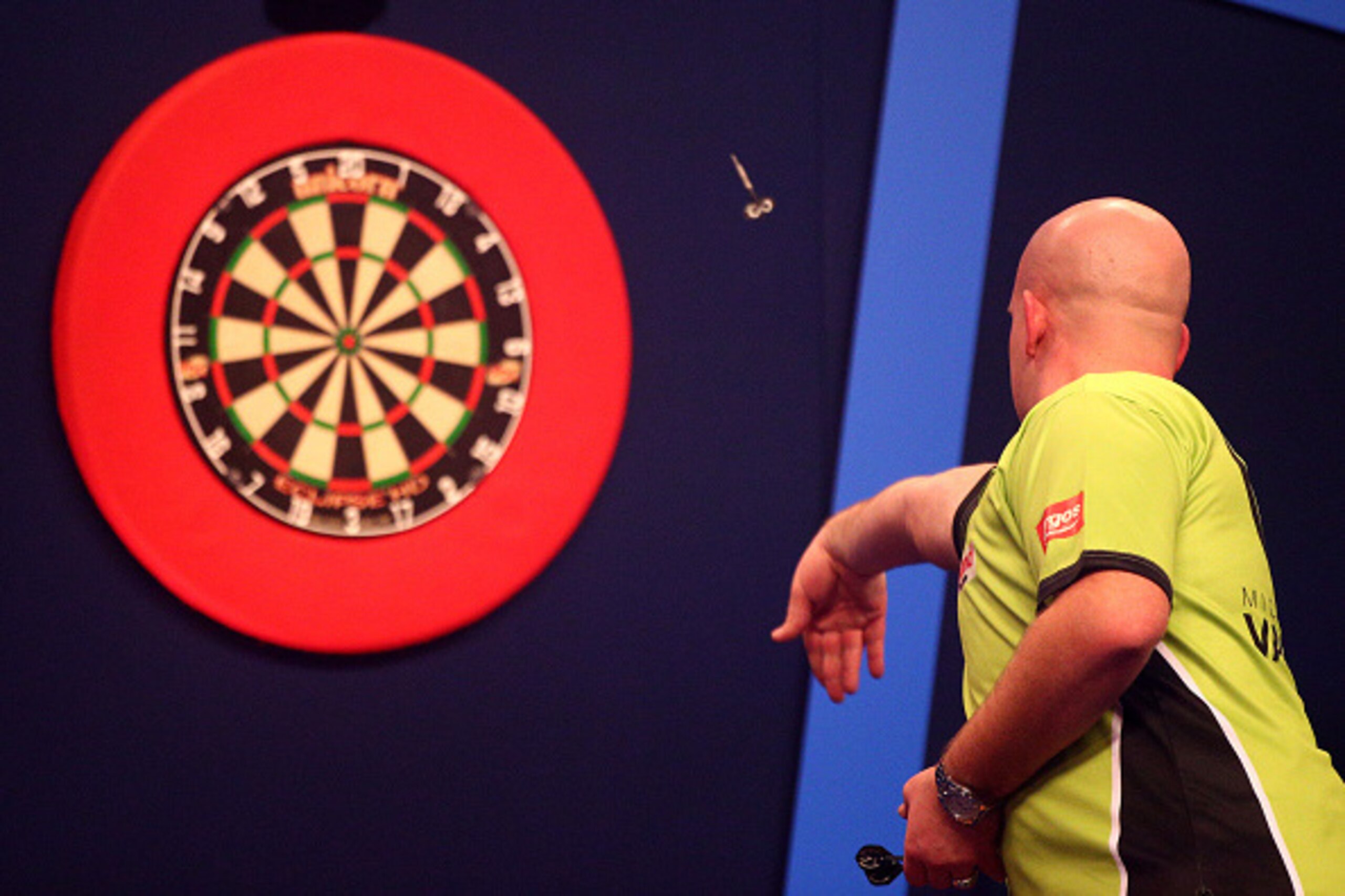 LONDON, ENGLAND - DECEMBER 18: Michael van Gerwen of Holland in action during his first round match against Joe Cullen of England during the William Hill PDC World Darts Championships on Day One at Alexandra Palace on December 18, 2014 in London, England. LONDON, ENGLAND - DECEMBER 18: Michael van Gerwen of Holland in action during his first round match against Joe Cullen of England during the William Hill PDC World Darts Championships on Day One at Alexandra Palace on December 18, 2014 in London, England.