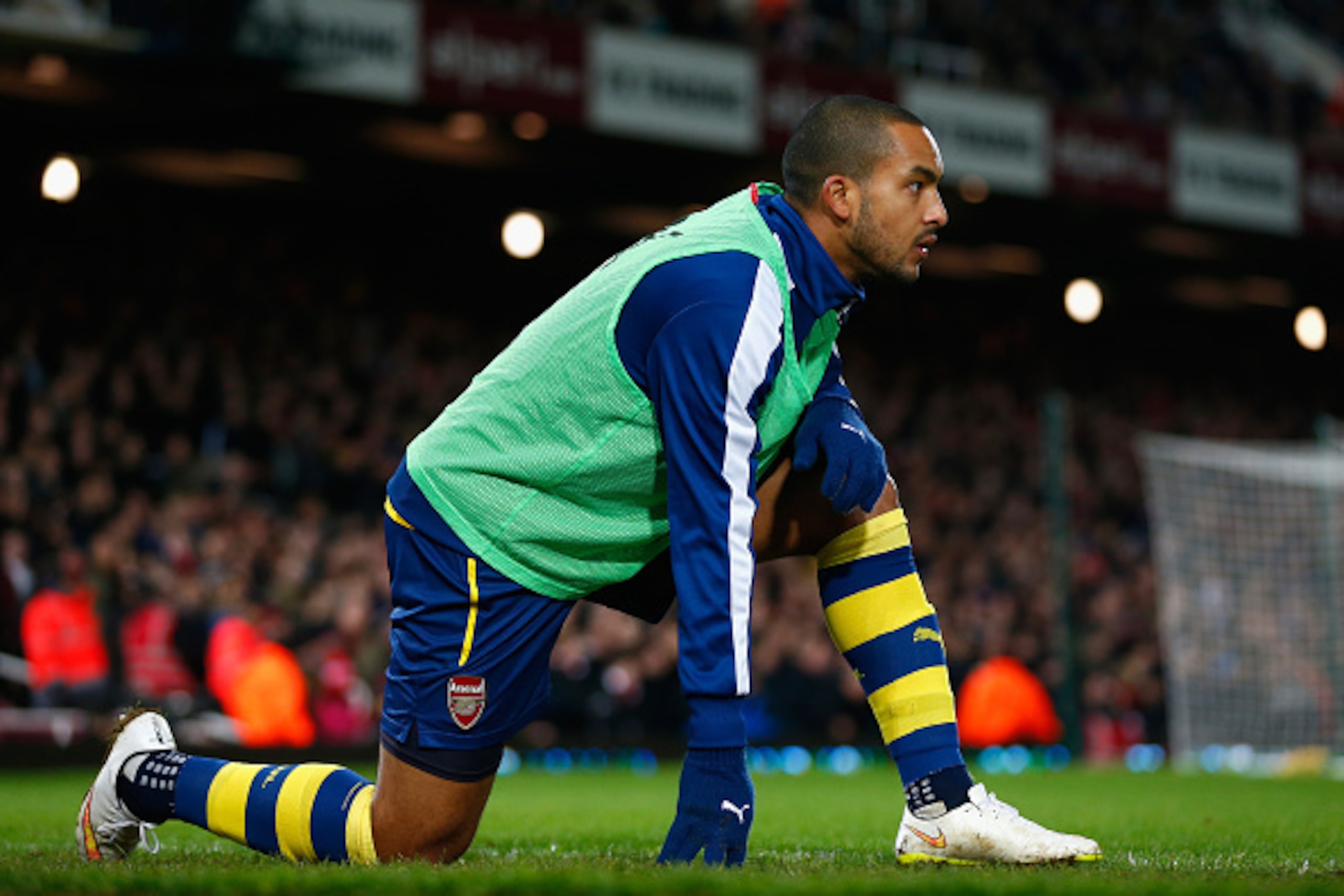 LONDON, ENGLAND - DECEMBER 28:  Theo Walcott of Arsenal warms up during the Barclays Premier League match between West Ham United and Arsenal at Boleyn Ground on December 28, 2014 in London, England.  (Photo by Julian Finney/Getty Images)