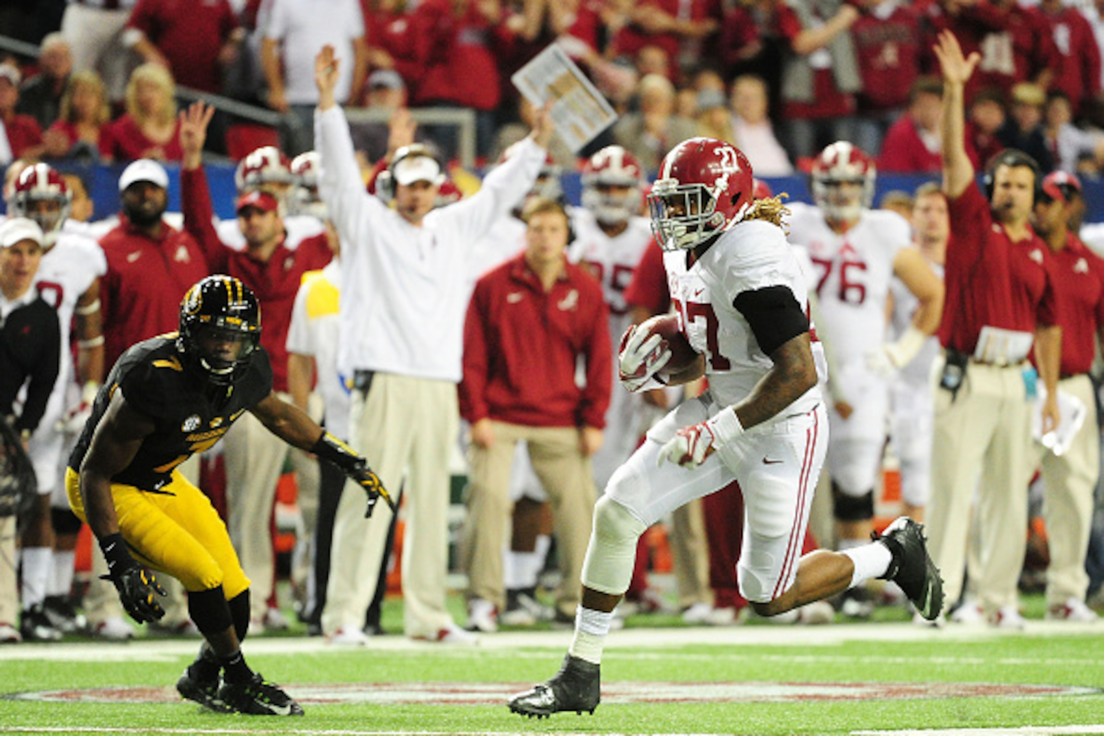 ATLANTA, GA - DECEMBER 06:  Derrick Henry #27 of the Alabama Crimson Tide rushes for a touchdown against the Missouri Tigers in the fourth quarter of the SEC Championship game at the Georgia Dome on December 6, 2014 in Atlanta, Georgia.  (Photo by Scott C