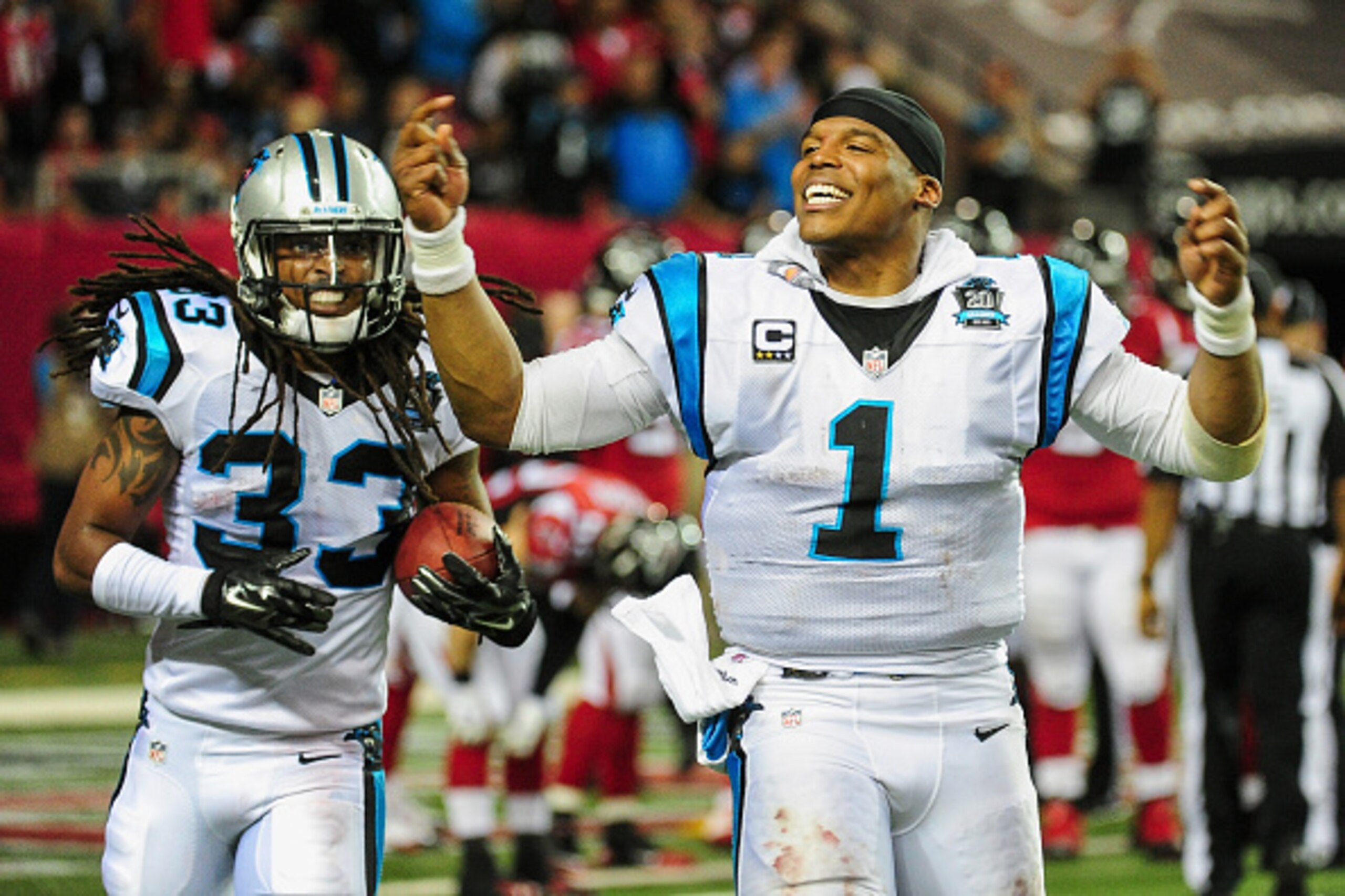 ATLANTA, GA - DECEMBER 28: Cam Newton #1 of the Carolina Panthers celebrates a interception return for a touchdown by Tre Boston #33 in the second half against the Atlanta Falcons at the Georgia Dome on December 28, 2014 in Atlanta, Georgia. (Photo by S ATLANTA, GA - DECEMBER 28: Cam Newton #1 of the Carolina Panthers celebrates a interception return for a touchdown by Tre Boston #33 in the second half against the Atlanta Falcons at the Georgia Dome on December 28, 2014 in Atlanta, Georgia. (Photo by S