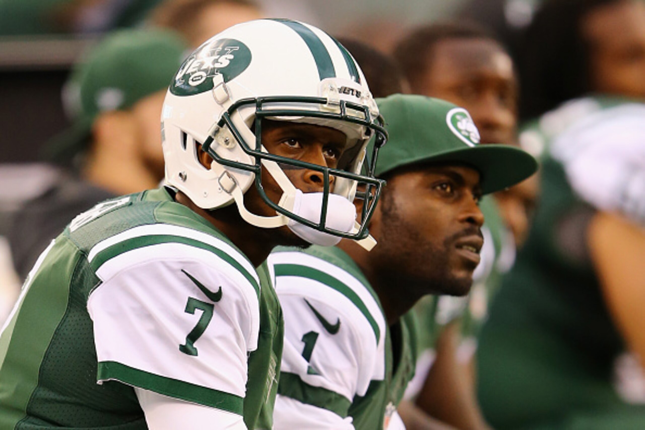 EAST RUTHERFORD, NJ - OCTOBER 26: Quarterbacks Geno Smith #7 of the New York Jets and Michael Vick #1 look on from the bench in the fourth quarter against the Buffalo Bills at MetLife Stadium on October 26, 2014 in East Rutherford, New Jersey. The Bills EAST RUTHERFORD, NJ - OCTOBER 26: Quarterbacks Geno Smith #7 of the New York Jets and Michael Vick #1 look on from the bench in the fourth quarter against the Buffalo Bills at MetLife Stadium on October 26, 2014 in East Rutherford, New Jersey. The Bills