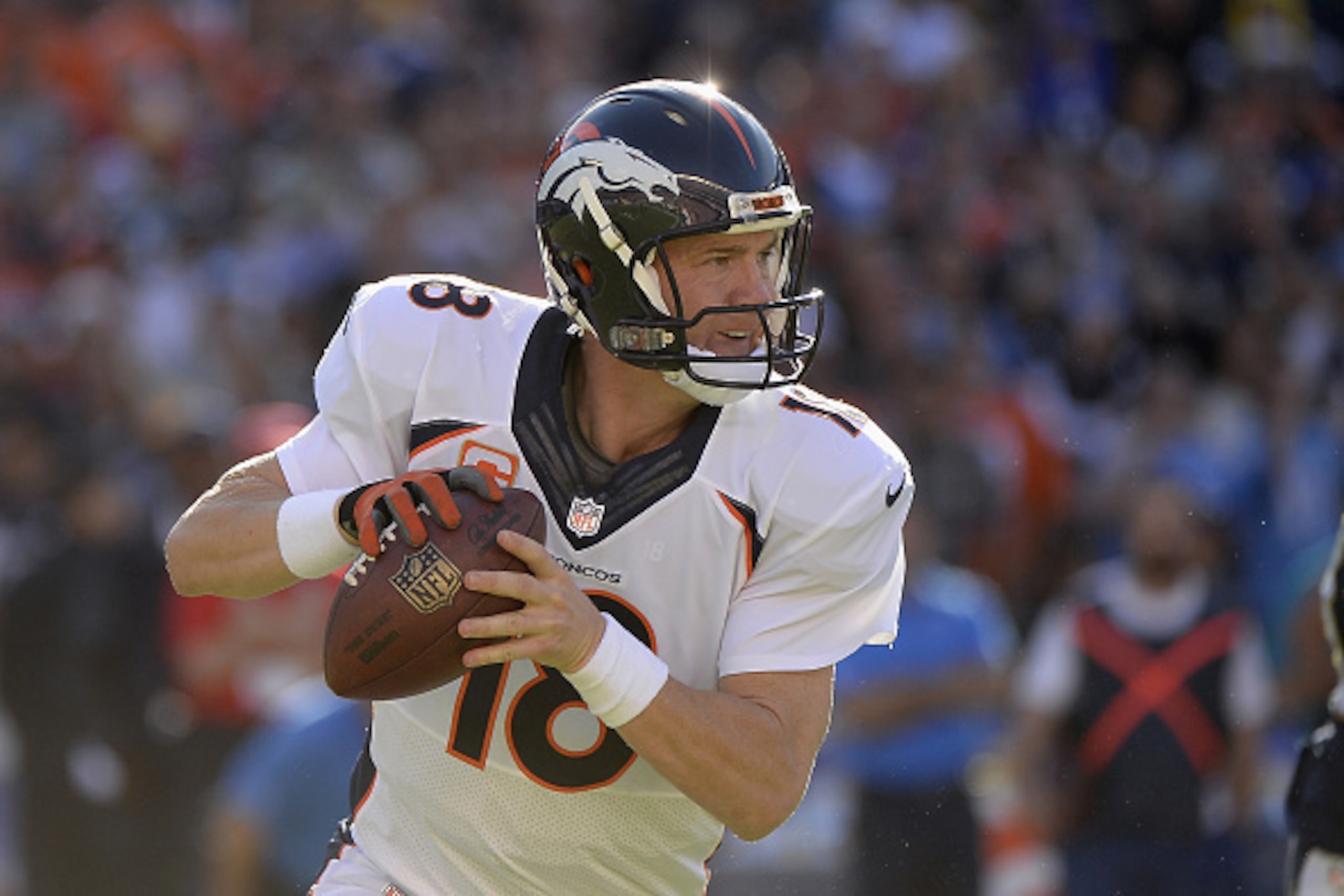 SAN DIEGO, CA - DECEMBER 14: Quarterback Peyton Manning #18 of the Denver Broncos looks to pass against the San Diego Chargers defense at Qualcomm Stadium on December 14, 2014 in San Diego, California. (Photo by Harry How/Getty Images) SAN DIEGO, CA - DECEMBER 14: Quarterback Peyton Manning #18 of the Denver Broncos looks to pass against the San Diego Chargers defense at Qualcomm Stadium on December 14, 2014 in San Diego, California. (Photo by Harry How/Getty Images)
