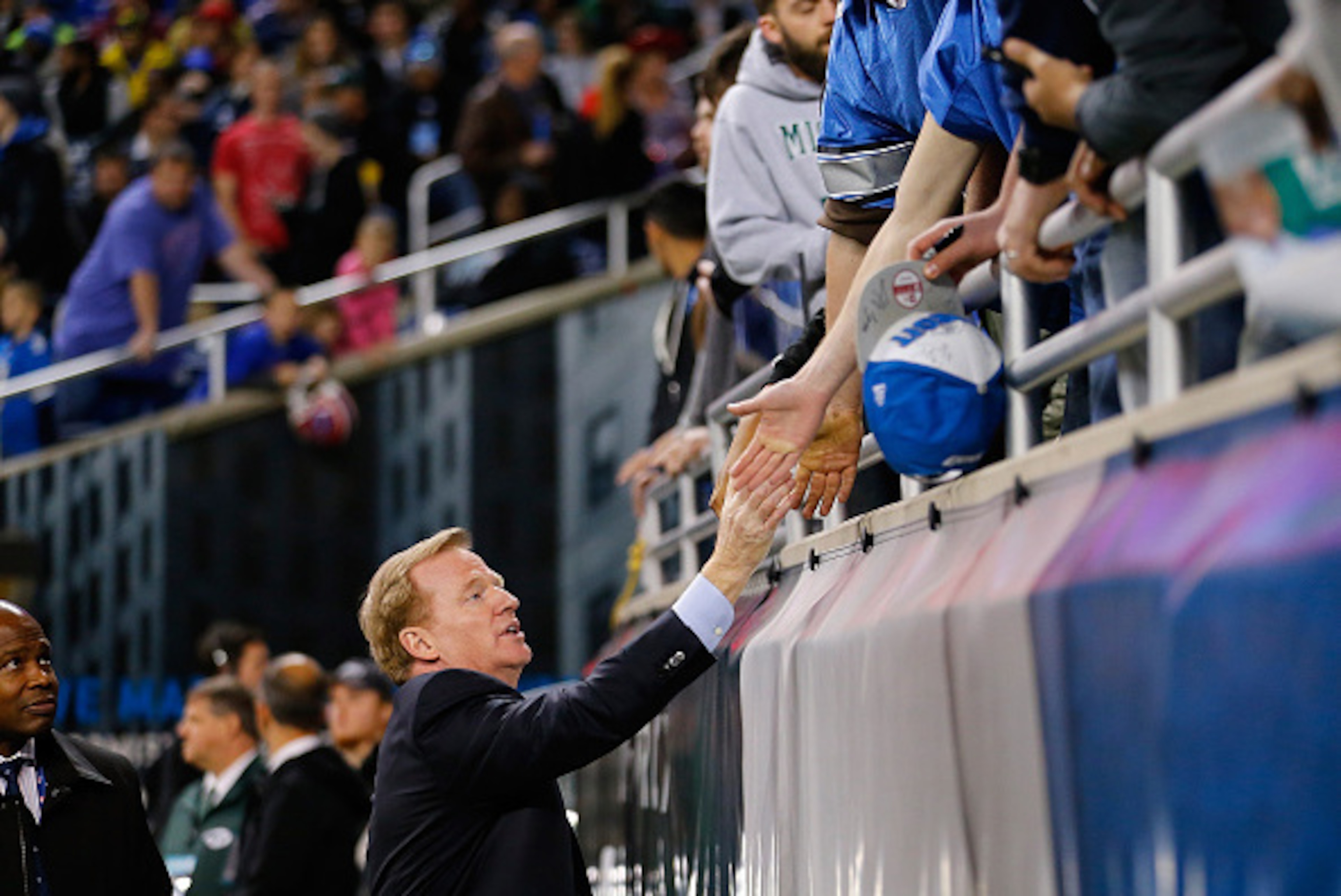 DETROIT, MI - NOVEMBER 24: NFL Commissioner Roger Goodell shakes hands with fans prior to the start or the game between the New York Jets and Buffalo Bills at Ford Field on November 24 , 2014 in Detroit, Michigan. (Photo by Leon Halip/Getty Images)