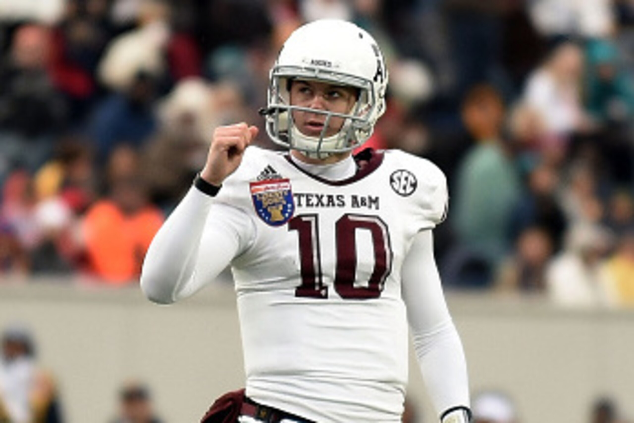 MEMPHIS, TN - DECEMBER 29:  Kyle Allen #10 of the Texas A&M Aggies reacts to a touchdown against the West Virginia Mountaineers during the third quarter of the 56th annual Autozone Liberty Bowl at Liberty Bowl Memorial Stadium on December 29, 2014 in Memp