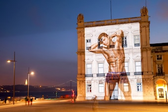 LISBON, PORTUGAL - UNDATED: In this handout provided by CR7 on August 3, 2014, an image of Cristiano Ronaldo is projected on to Praca Do Comercio, Lisbon. Cristiano Ronaldo officially unveils his new fashion campaign, Rankin X Ronaldo for CR7 Underwear, t