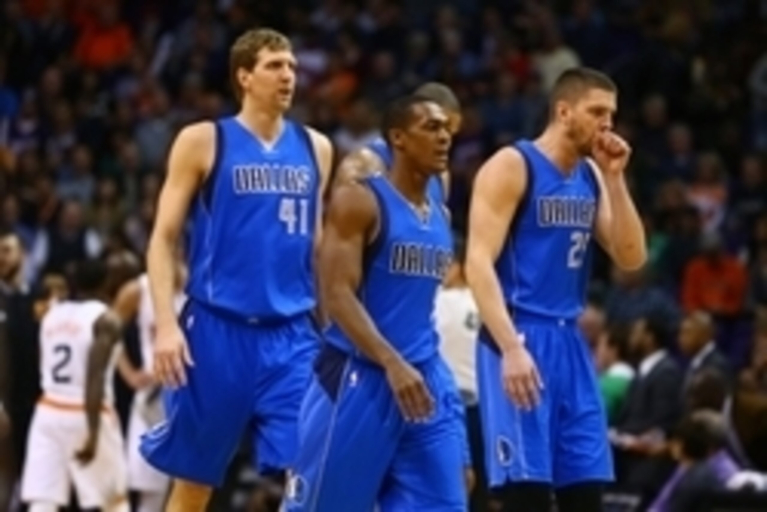 Dec 23, 2014; Phoenix, AZ, USA; Dallas Mavericks guard Rajon Rondo (9), forward Dirk Nowitzki (41)and forward Chandler Parsons (25) against the Phoenix Suns at US Airways Center. The Suns defeated the Mavericks 124-115. Mandatory Credit: Mark J. Rebilas-U