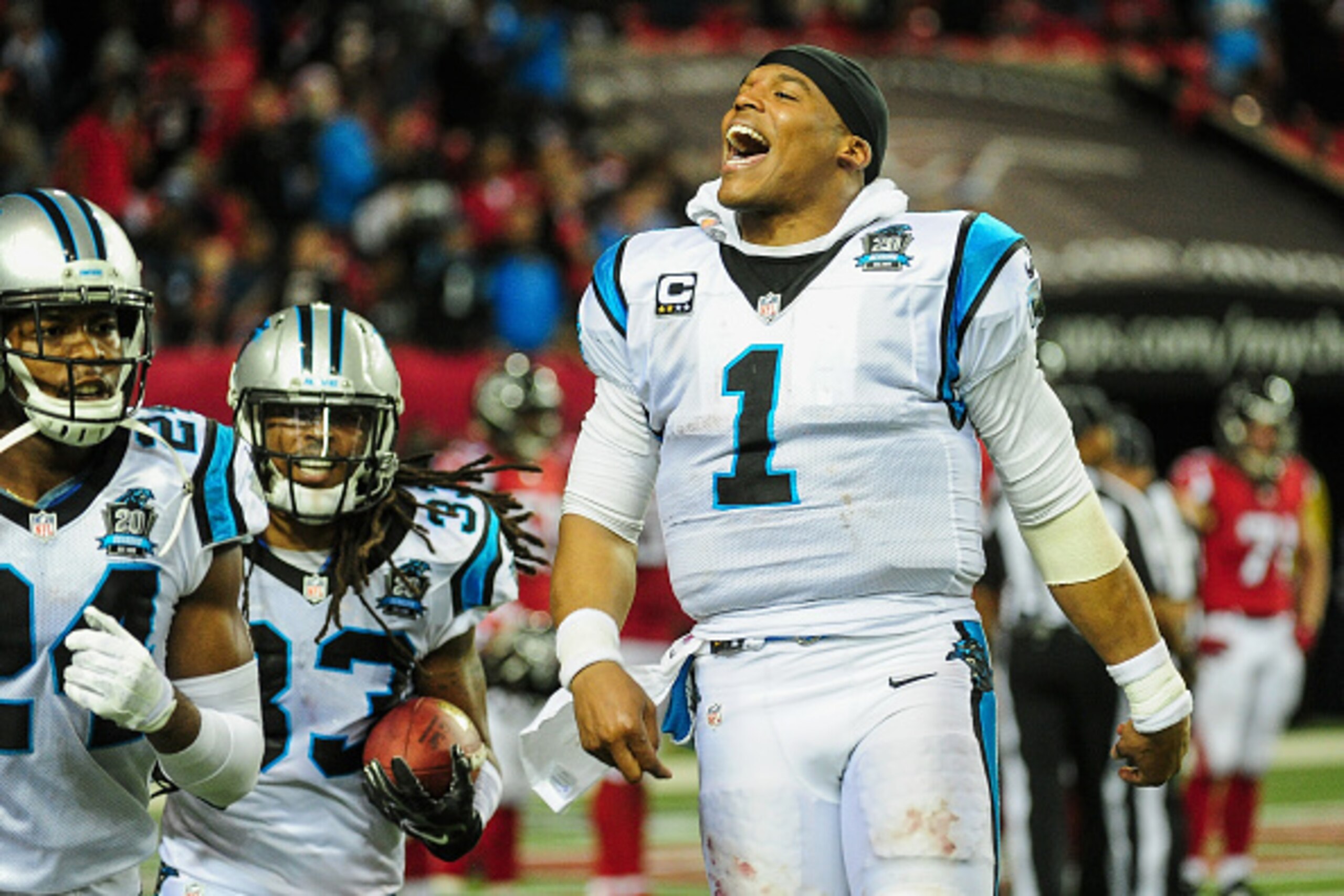 ATLANTA, GA - DECEMBER 28:  Cam Newton #1 of the Carolina Panthers celebrates a interception return for a touchdown by Tre Boston #33 in the second half against the Atlanta Falcons at the Georgia Dome on December 28, 2014 in Atlanta, Georgia.  (Photo by S