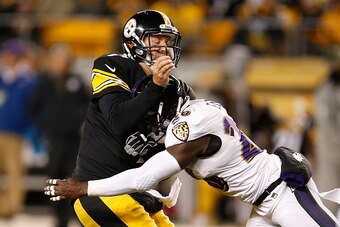 PITTSBURGH, PA - NOVEMBER 02:  Courtney Upshaw #91 of the Baltimore Ravens is called for a late hit on Ben Roethlisberger #7 of the Pittsburgh Steelers during the second quarter at Heinz Field on November 2, 2014 in Pittsburgh, Pennsylvania.  (Photo by Gr