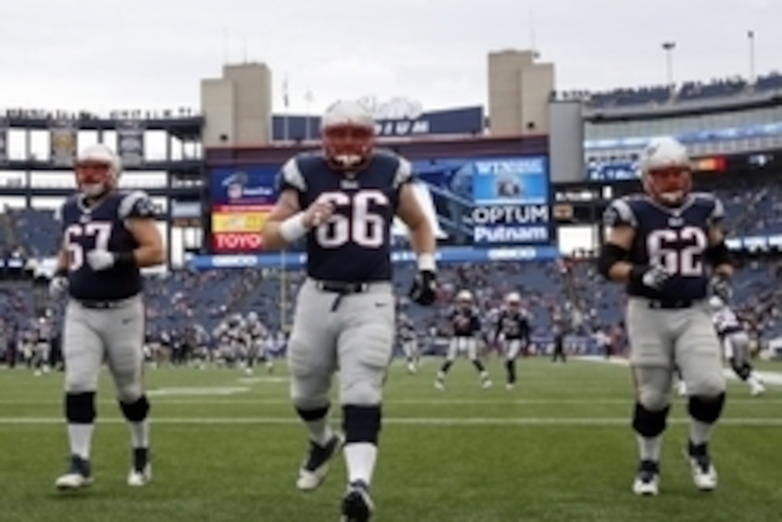 Dec 28, 2014; Foxborough, MA, USA; New England Patriots guard Josh Kline (67), center Bryan Stork (66) and guard Ryan Wendell (62) warm up before the start of the game against the Buffalo Bills at Gillette Stadium. Mandatory Credit: David Butler II-USA TO