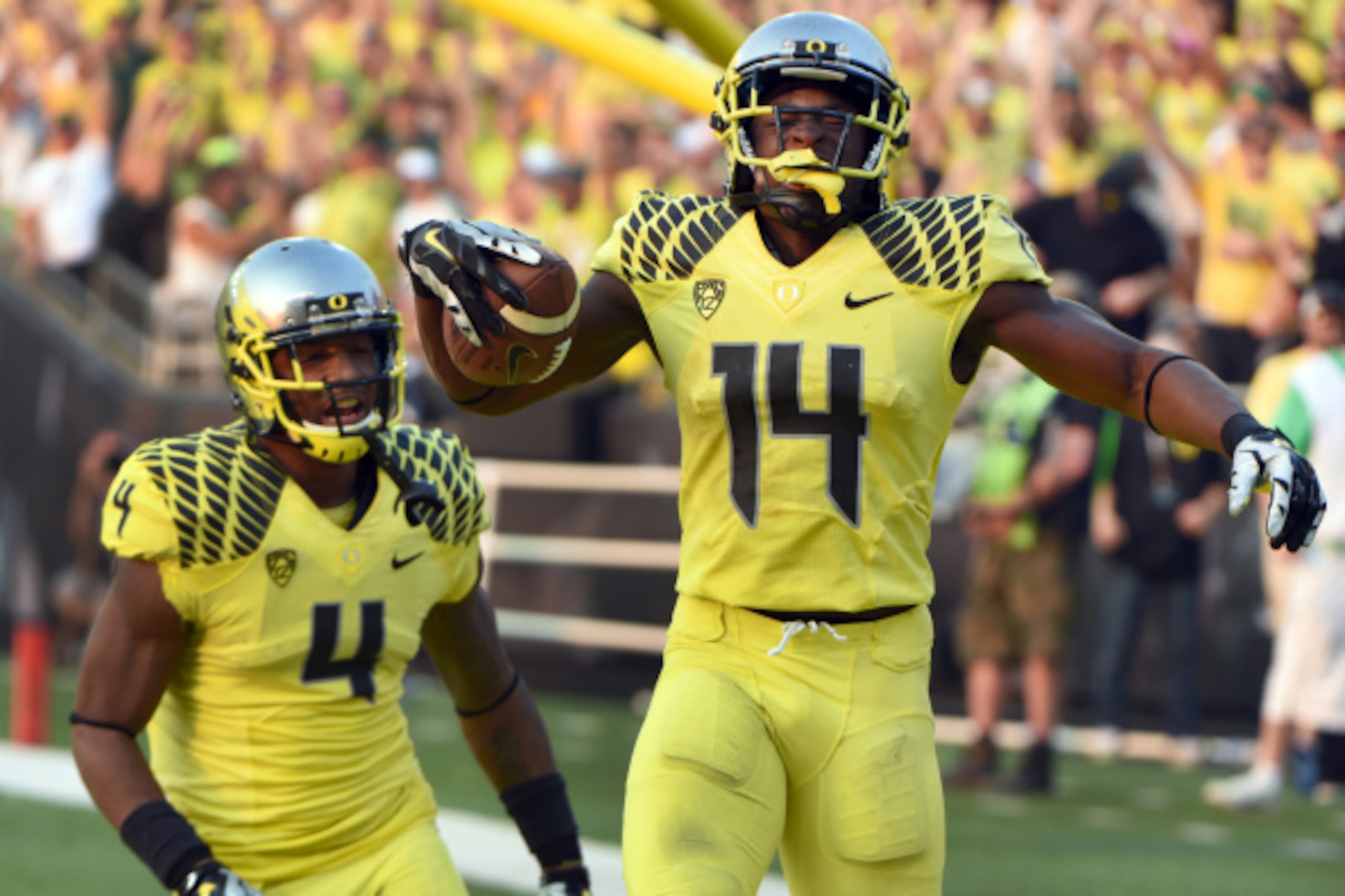 EUGENE, OR -SEPTEMBER 06: Defensive back Ifo Ekpre-Olomu #14 of the Oregon Ducks celebrates with defensive back Erick Dargan #4 of the Oregon Ducks after intercepting a pass during the fourth quarter of the game against the Michigan State Spartans at Autz