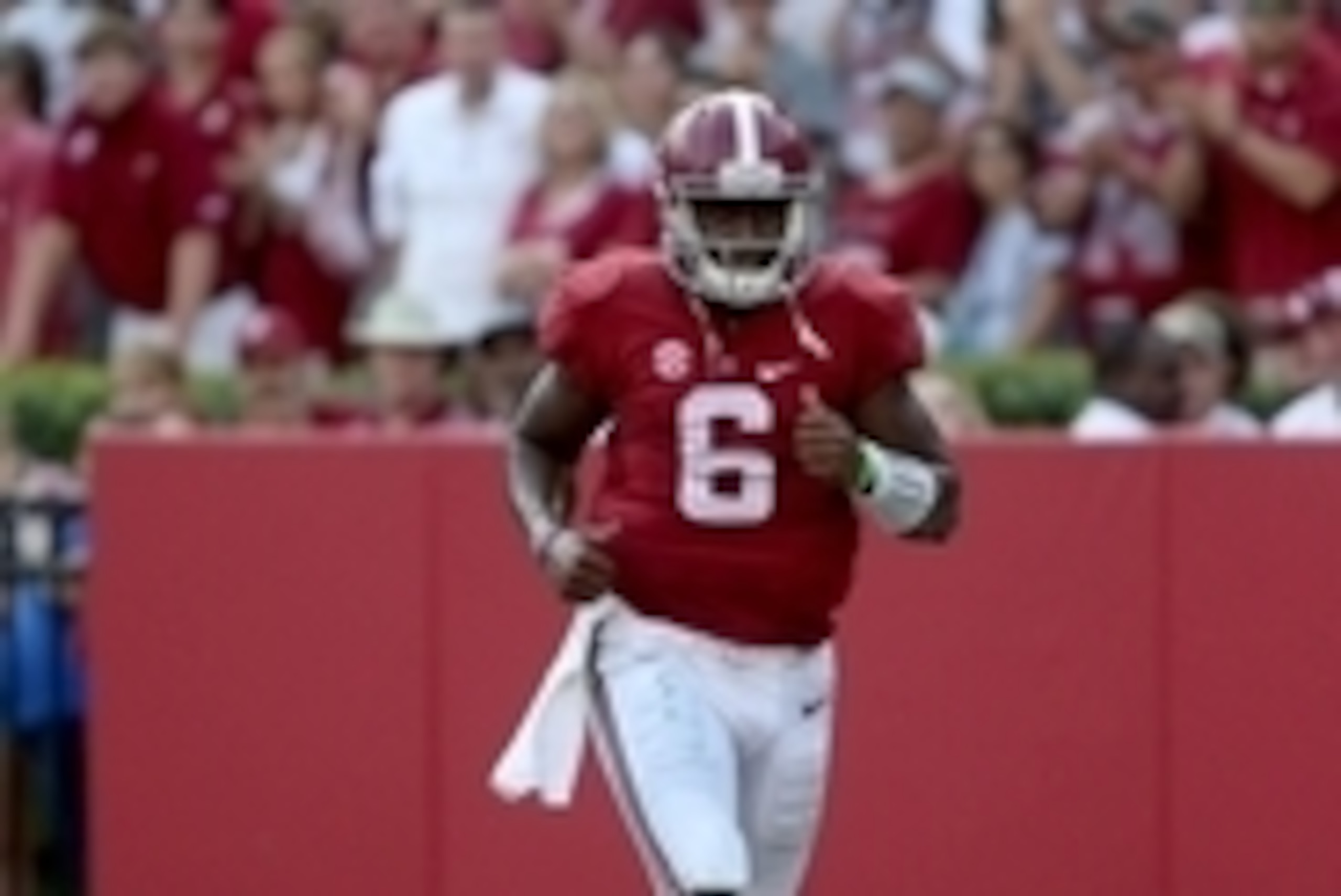 Sep 20, 2014; Tuscaloosa, AL, USA; Alabama Crimson Tide quarterback Blake Sims (6) jogs toward the locker room after an injury in the third quarter of their game against the Florida Gators at Bryant-Denny Stadium. Alabama won 42-21. Mandatory Credit: Jaso