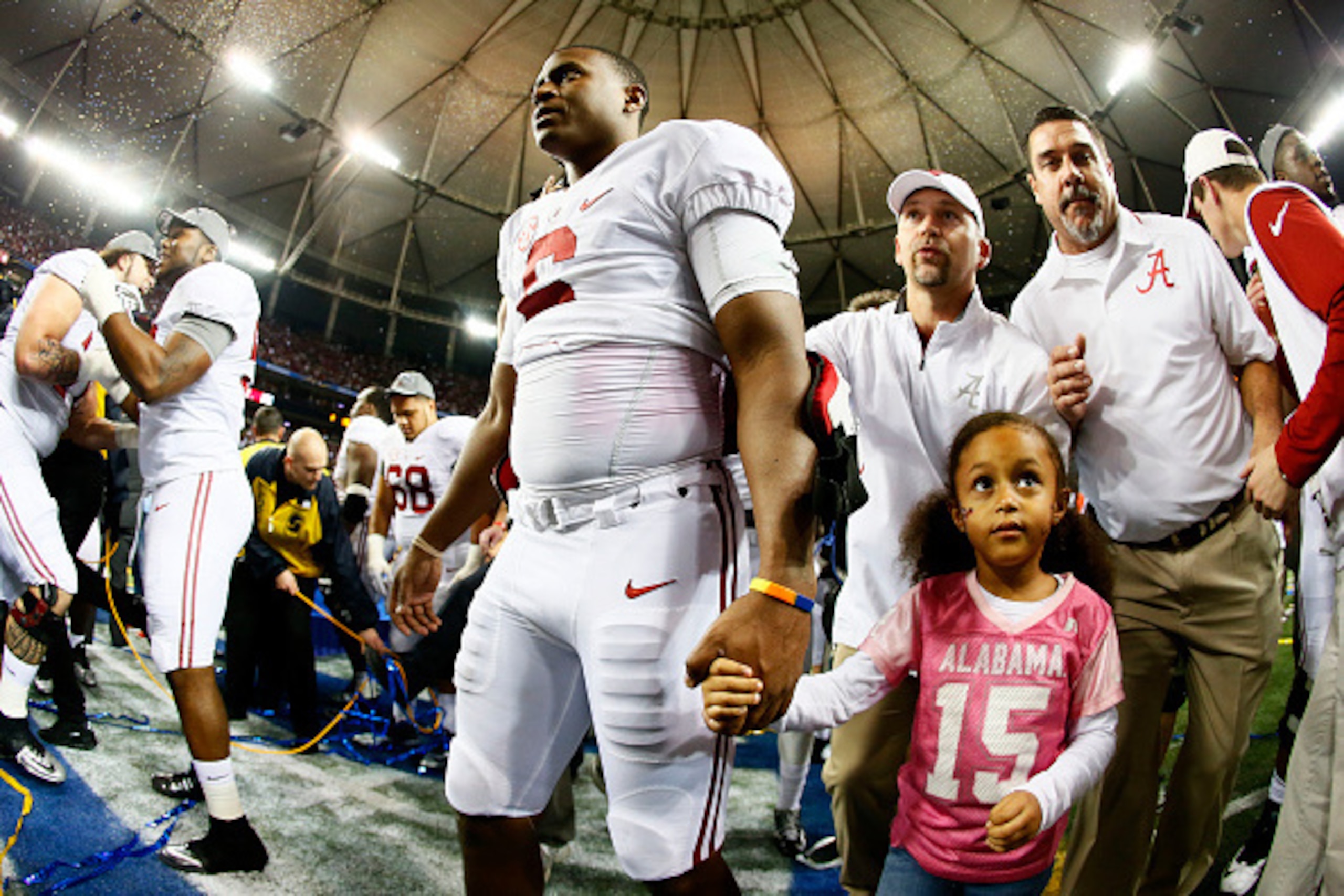 ATLANTA, GA - DECEMBER 06:  Blake Sims #6 of the Alabama Crimson Tide celebrates their 42 to 13 win over the Missouri Tigers in the SEC Championship game with his daughter Kyla at the Georgia Dome on December 6, 2014 in Atlanta, Georgia.  (Photo by Kevin 