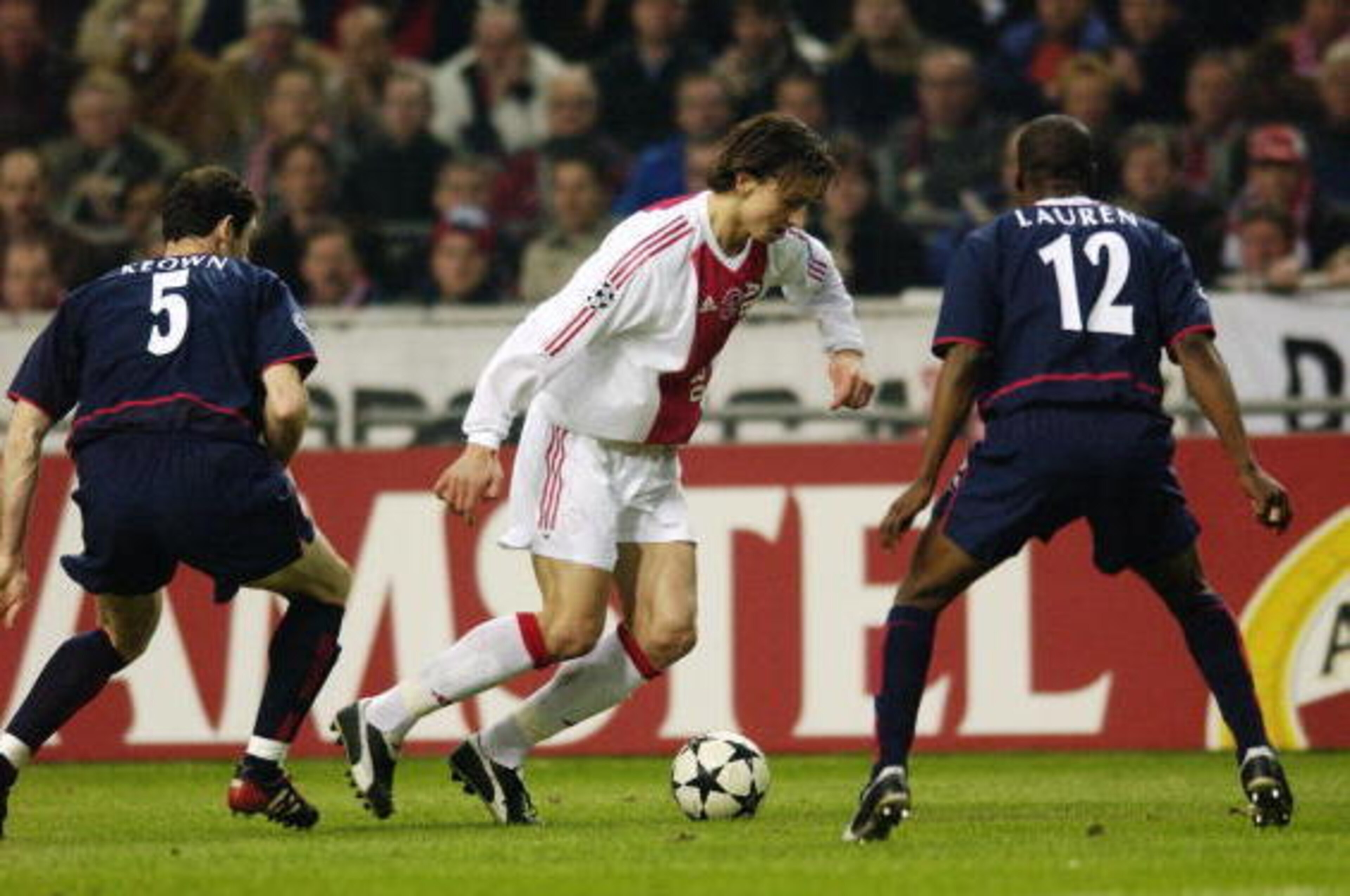 AMSTERDAM - FEBRUARY 26: Zlatan Ibrahimovic of Ajax takes on Martin Keown and Lauren of Arsenal during the UEFA Champions League Second Phase Group B match held on February 26, 2003 at The Amsterdam ArenA, in Amsterdam, Holland. The match ended in a 0-0 AMSTERDAM - FEBRUARY 26: Zlatan Ibrahimovic of Ajax takes on Martin Keown and Lauren of Arsenal during the UEFA Champions League Second Phase Group B match held on February 26, 2003 at The Amsterdam ArenA, in Amsterdam, Holland. The match ended in a 0-0
