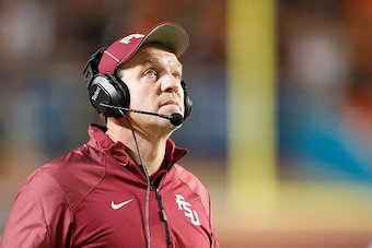 MIAMI GARDENS, FL - NOVEMBER 15: Head coach Jimbo Fisher of the Florida State Seminoles watches a replay during a break in second quarter action against the Miami Hurricanes on November 15, 2014 at Sun Life Stadium in Miami Gardens, Florida. (Photo by Joe