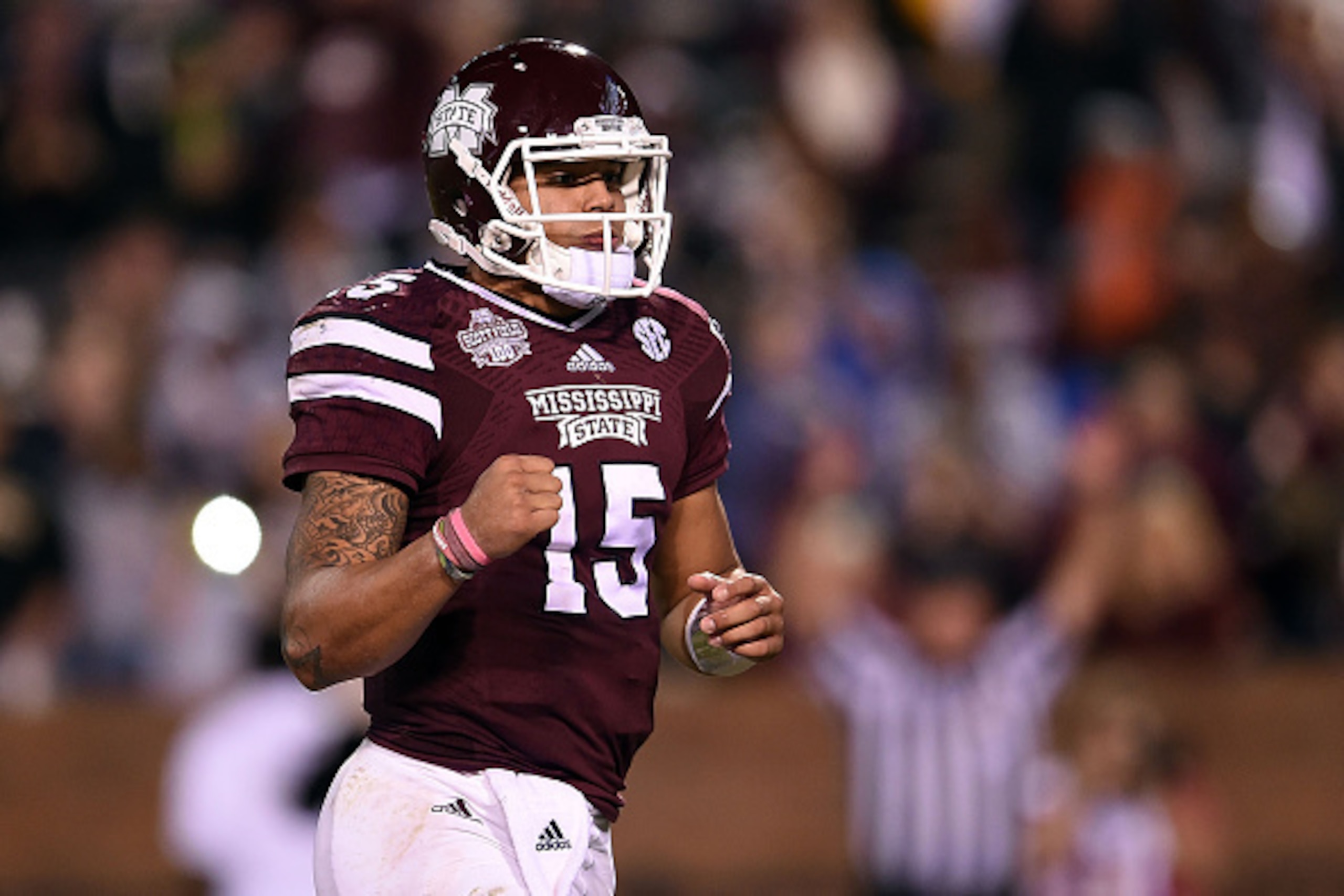 STARKVILLE, MS - NOVEMBER 22:  Dak Prescott #15 of the Mississippi State Bulldogs reacts to a touchdown during the third quarter of a game against the Vanderbilt Commodores at Davis Wade Stadium on November 22, 2014 in Starkville, Mississippi.  (Photo by 