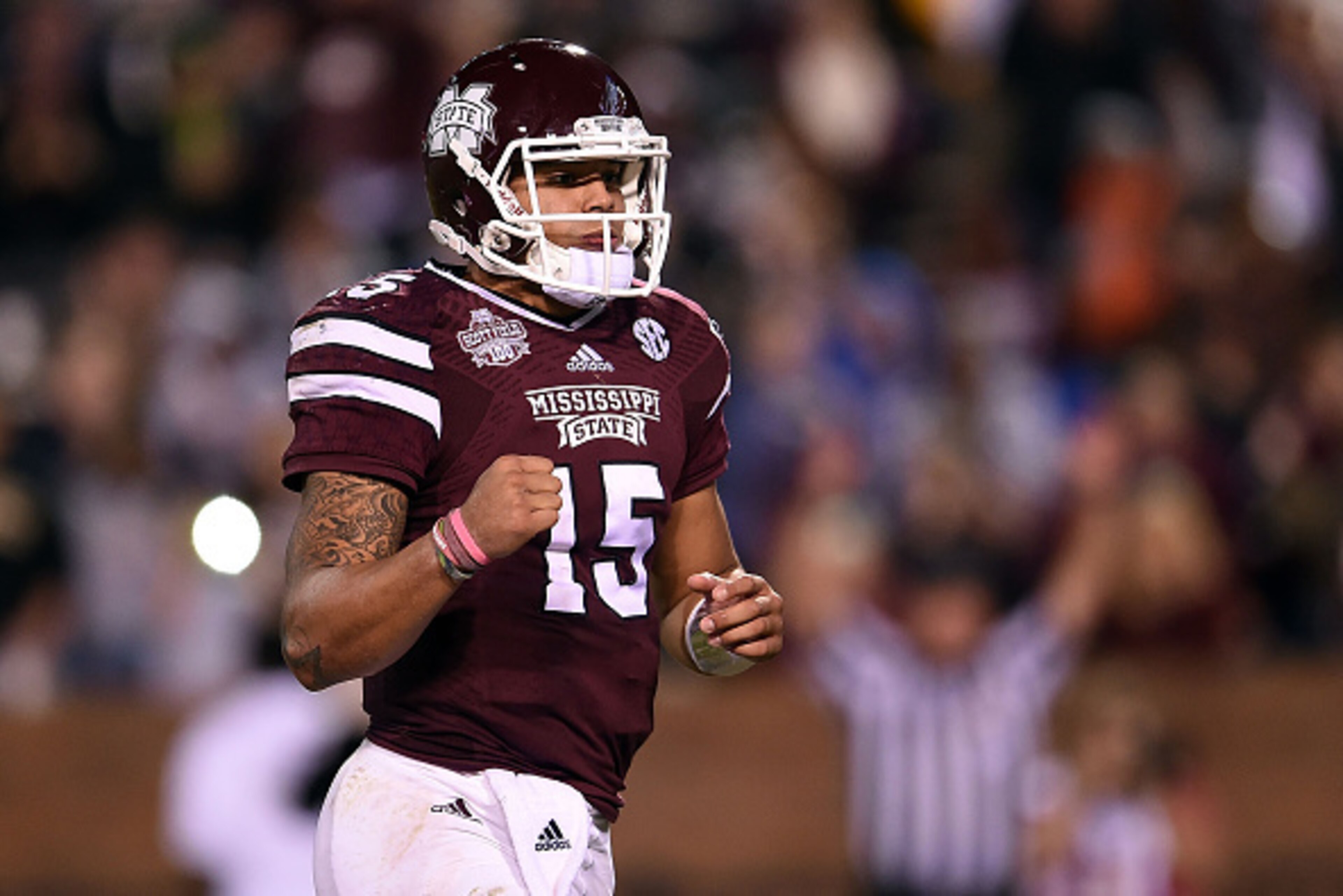 STARKVILLE, MS - NOVEMBER 22:  Dak Prescott #15 of the Mississippi State Bulldogs reacts to a touchdown during the third quarter of a game against the Vanderbilt Commodores at Davis Wade Stadium on November 22, 2014 in Starkville, Mississippi.  (Photo by 