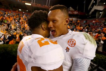 COLUMBIA, SC - NOVEMBER 01:  Teammates Cameron Sutton #23  and Joshua Dobbs #11 of the Tennessee Volunteers celebrate after defeating the South Carolina Gamecocks 45-42 in overtime at Williams-Brice Stadium on November 1, 2014 in Columbia, South Carolina.