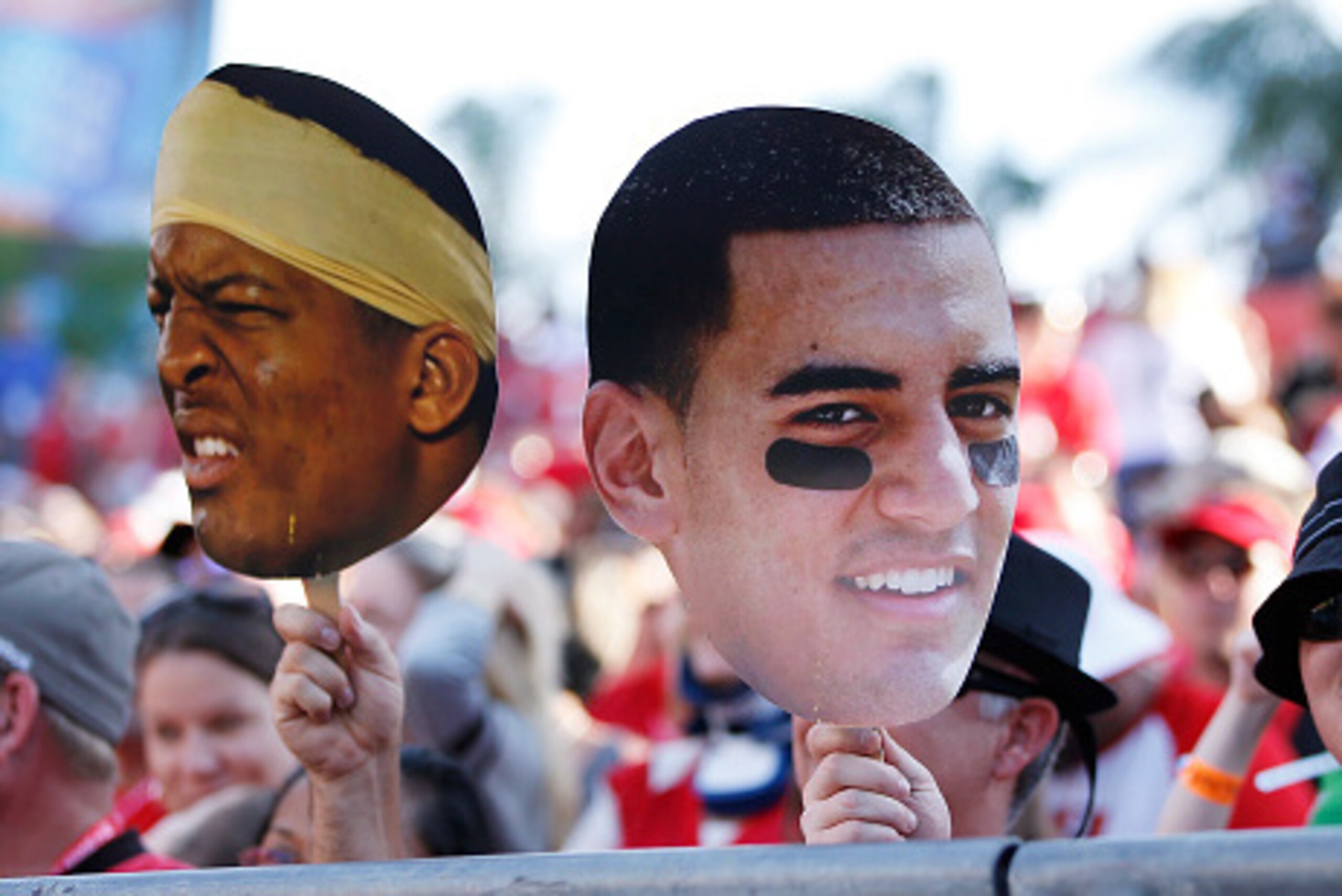 TAMPA, FL - DECEMBER 28: Tampa Bay Buccaneers fans display photos of Oregon quarterback Marcus Mariota and Florida State quarterback Jameis Winston late in the game against the New Orleans Saints at Raymond James Stadium on December 28, 2014 in Tampa, Flo