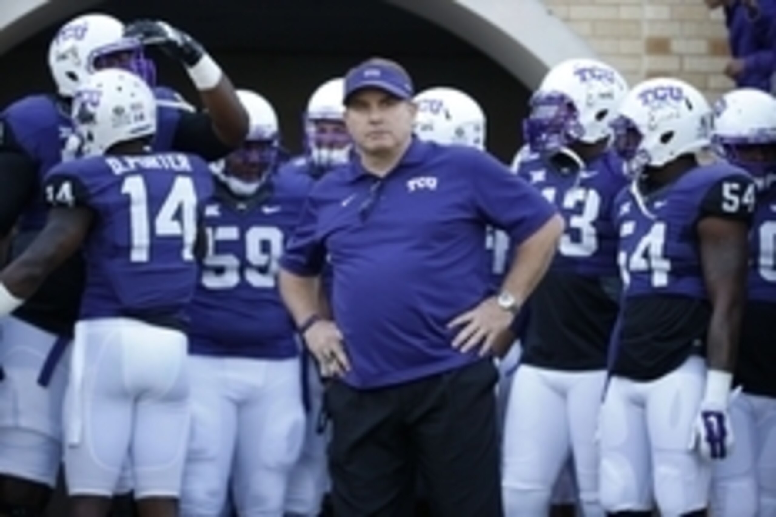 Dec 6, 2014; Fort Worth, TX, USA; TCU Horned Frogs head coach Gary Patterson leads his team out onto the field before the game against the Iowa State Cyclones at Amon G. Carter Stadium. Mandatory Credit: Kevin Jairaj-USA TODAY Sports